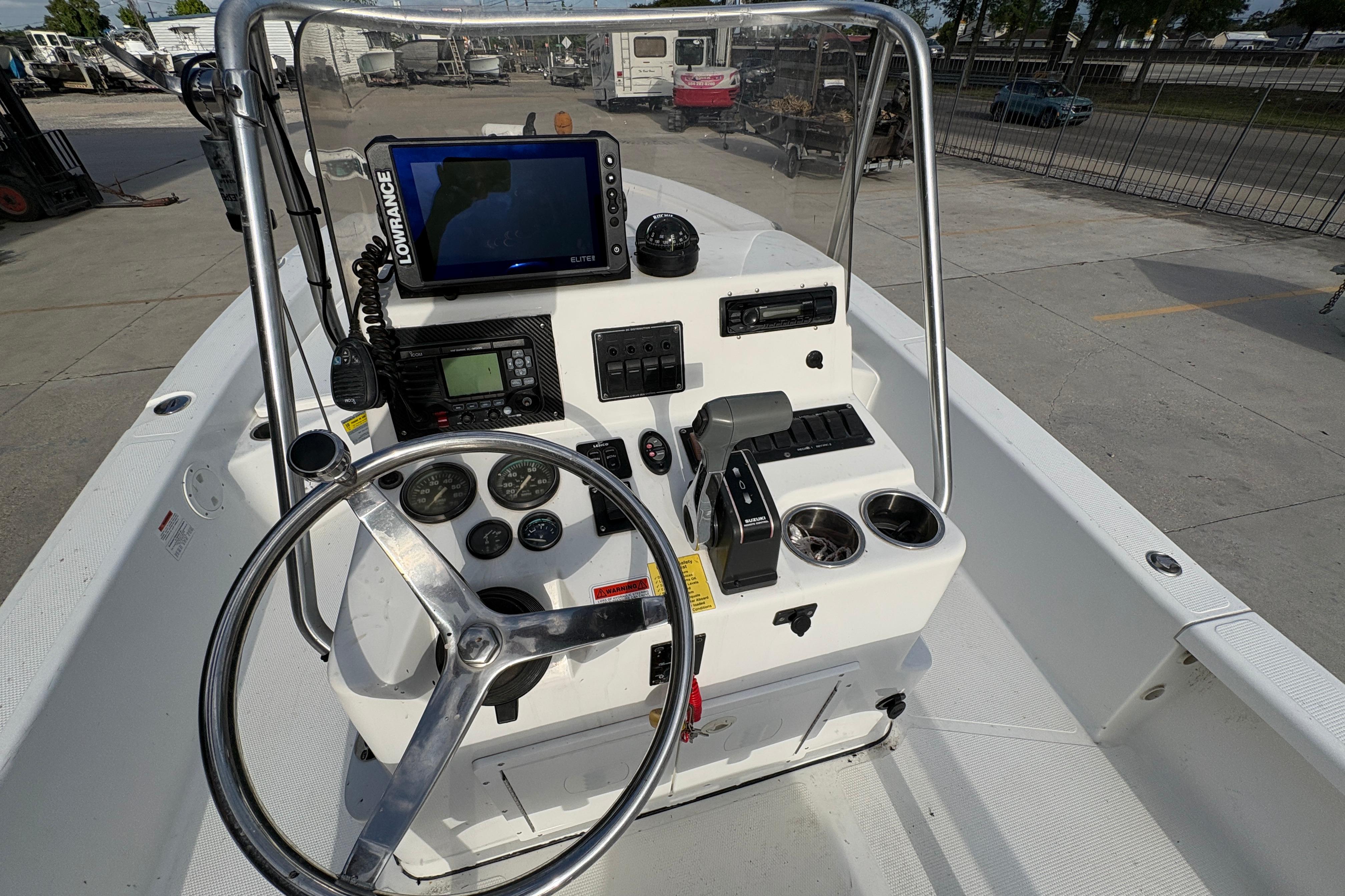 Steering console of a 2012 BlackJack 224 boat with navigation equipment.