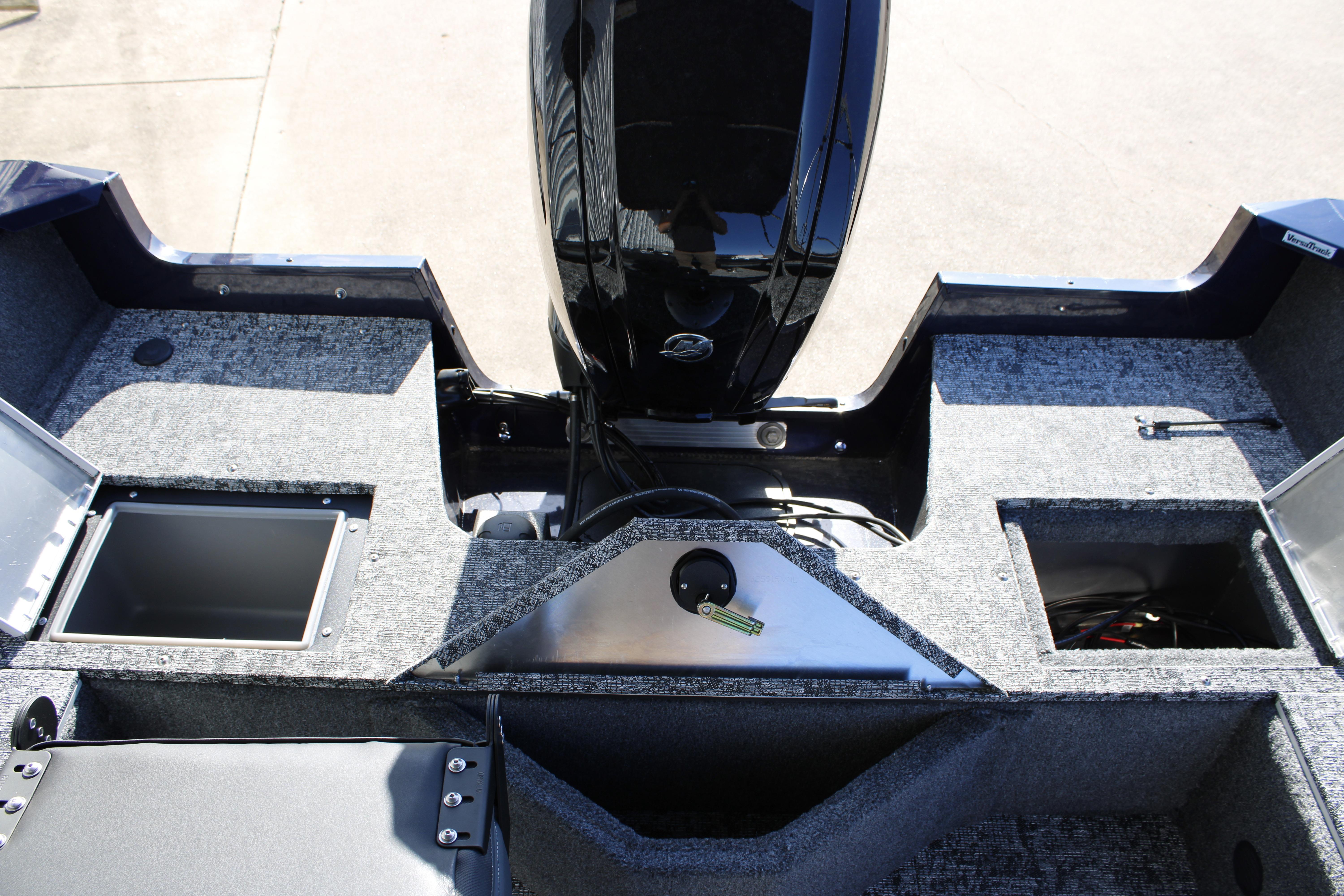 2026 Tracker Pro Guide V-16 SC boat interior with storage compartments and motor.
