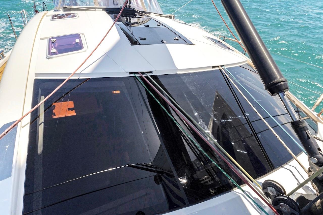 Sailing yacht Southerly 57 RS (2011) deck view with ropes and windows on turquoise sea.