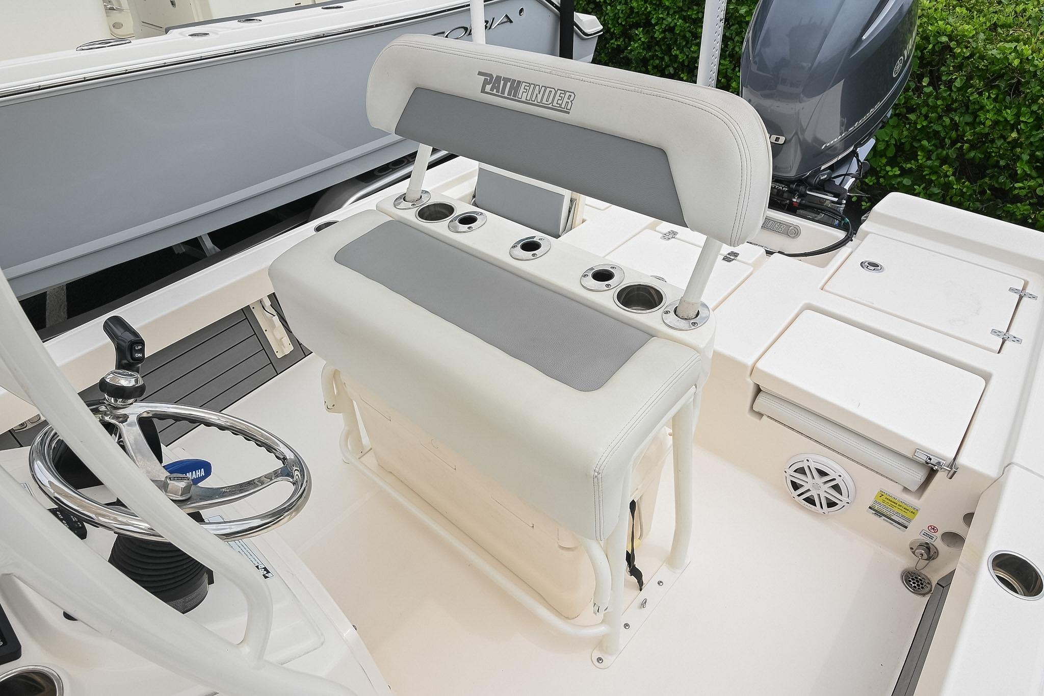 2021 Pathfinder 2200 TRS boat interior with steering wheel and seating area.