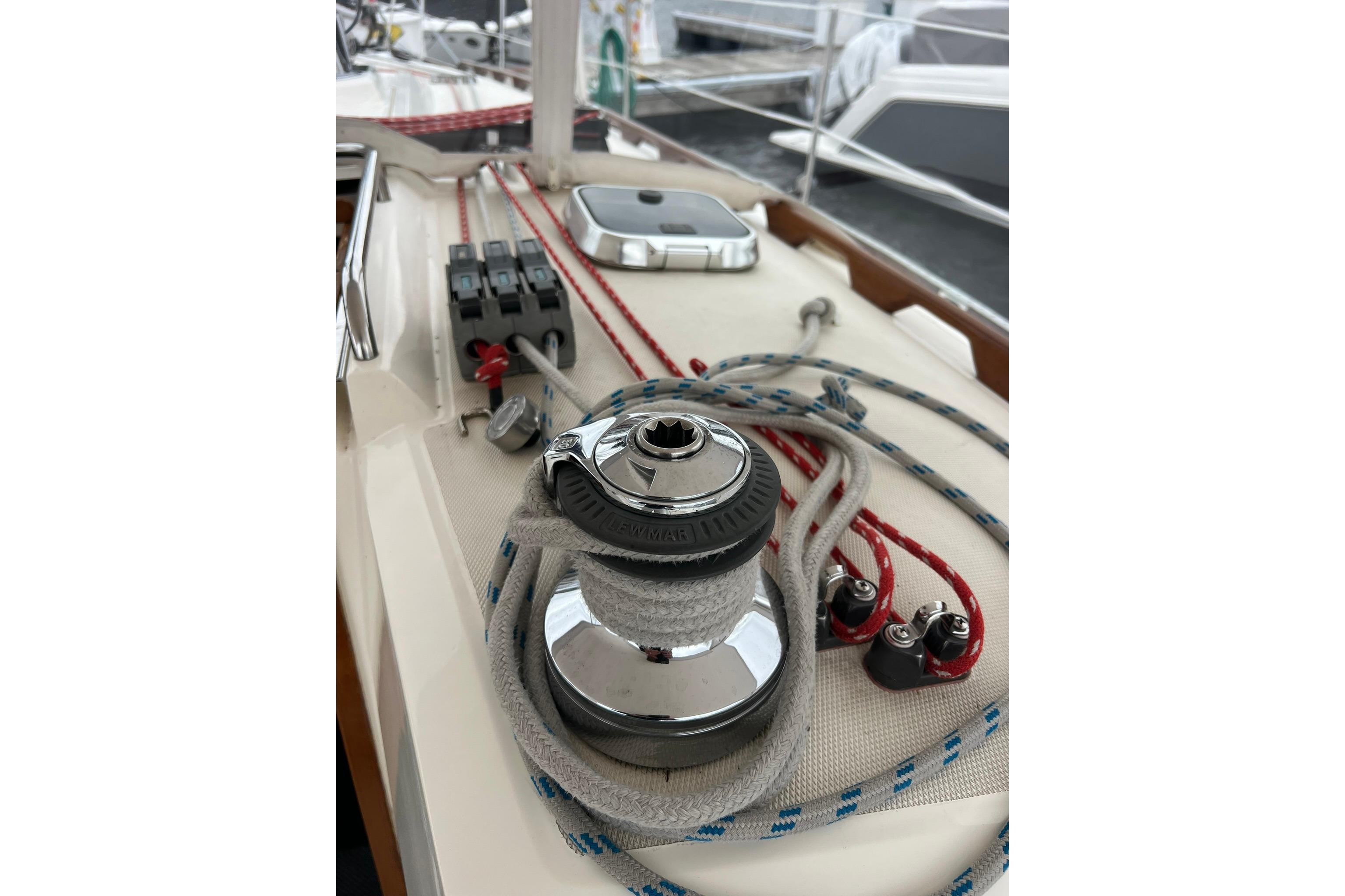 Close-up of a 1998 Sabre 362 sailboat deck with winch and ropes.