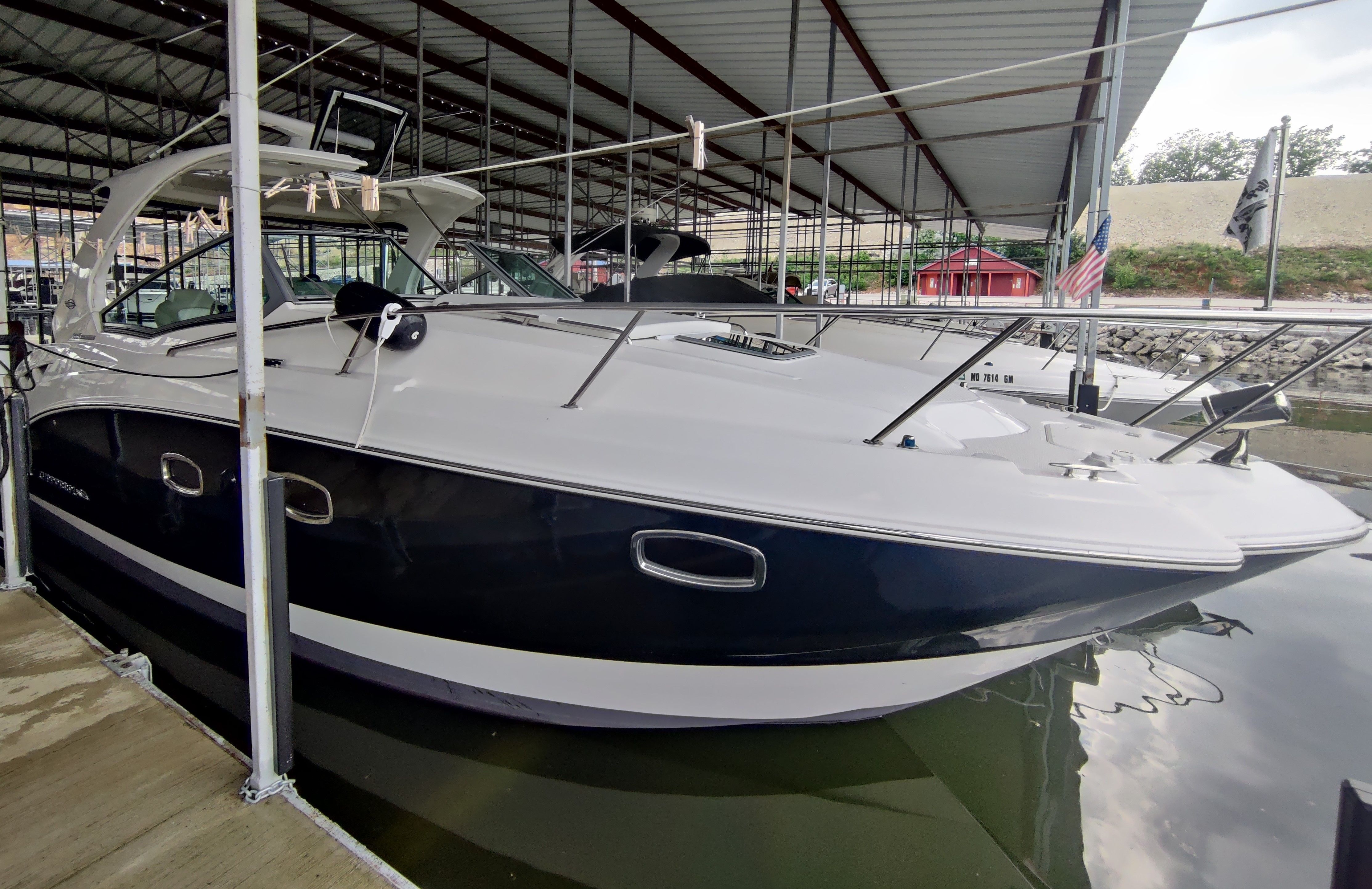 2014 Chaparral 330 Signature yacht docked in marina.