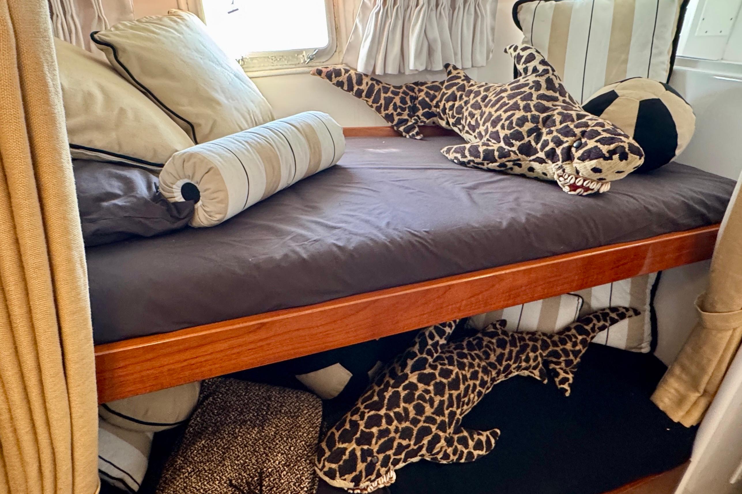 1958 Blanchard Pilothouse interior with plush shark toys on a bunk bed.