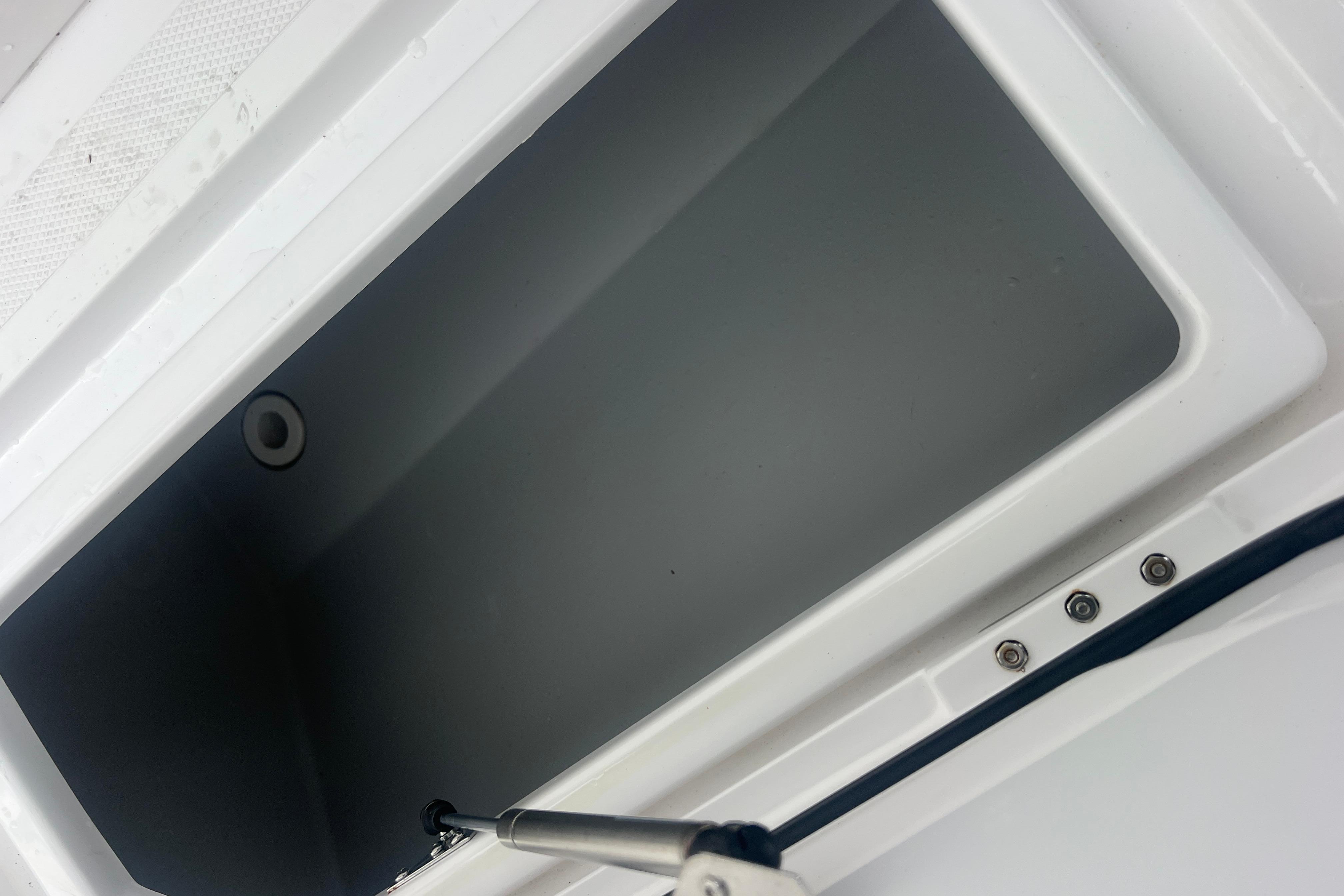 Open storage compartment on 2022 Sea-Lion 34 TE boat.