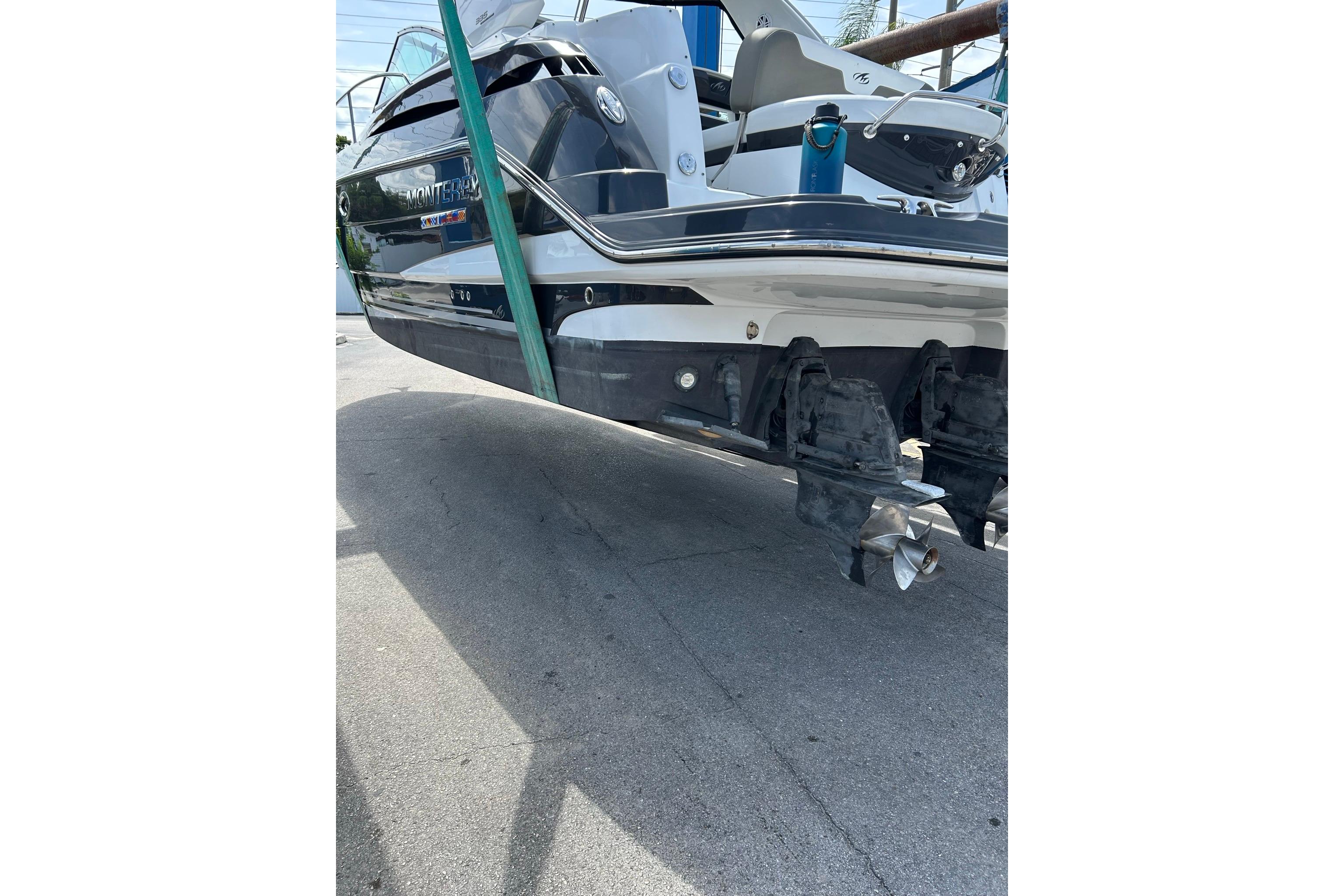 2019 Monterey 335 Sport Yacht on dry dock, showcasing dual propellers.