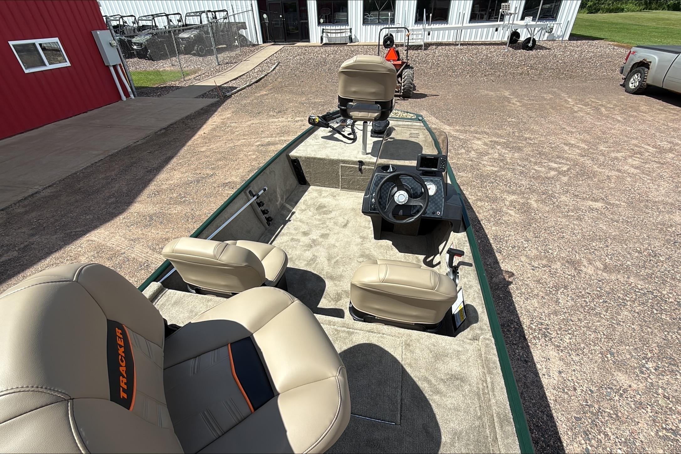 2026 Tracker Bass Tracker Classic Limited boat with beige seats and steering console.