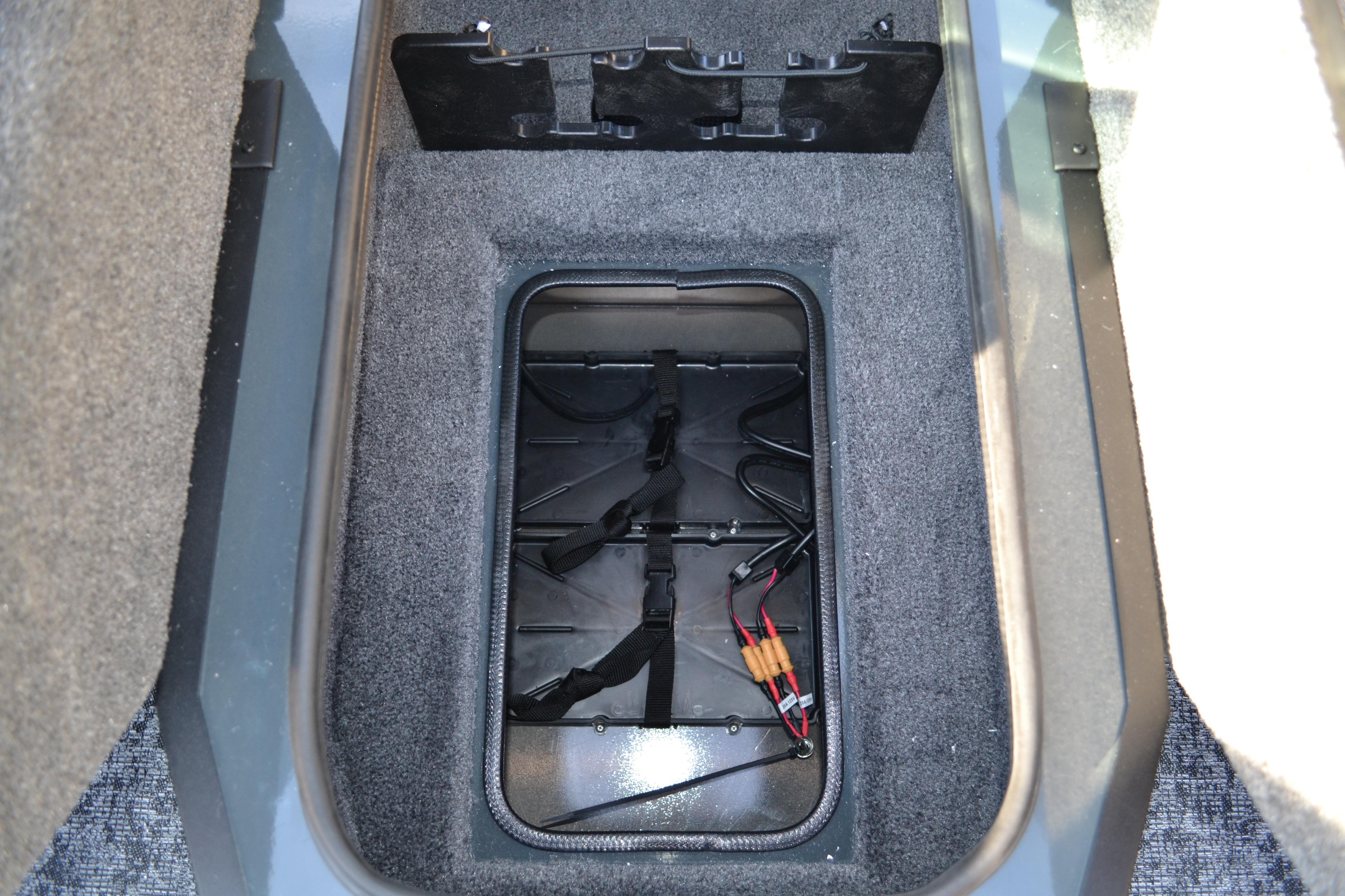 2026 Ranger VS1882SC Reata storage compartment with wiring and carpeted interior.