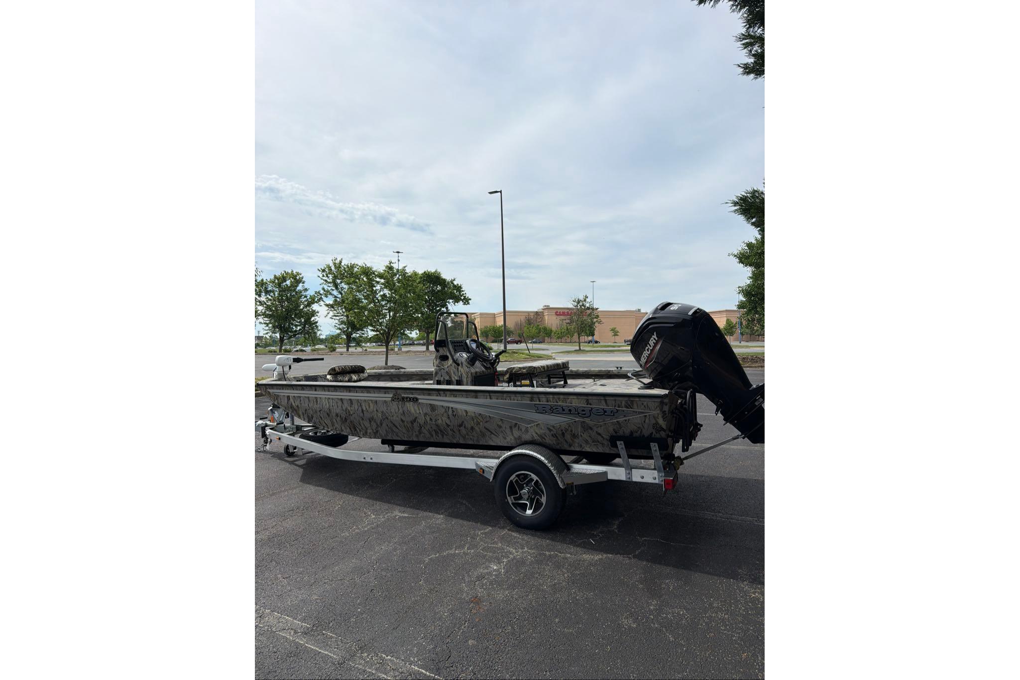 2026 Ranger RB190 boat on trailer in parking lot, overcast sky.