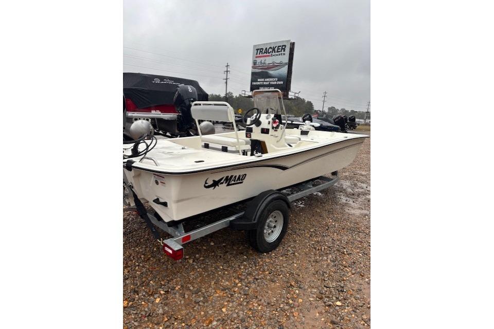 2026 Mako Pro Skiff 17 CC boat on trailer in outdoor dealership lot.