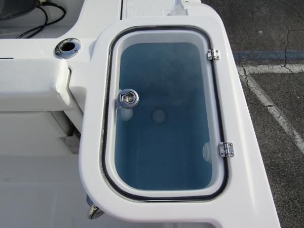 Livewell on 2025 Wellcraft 243 Fisherman boat, featuring a clear lid and secure latch.