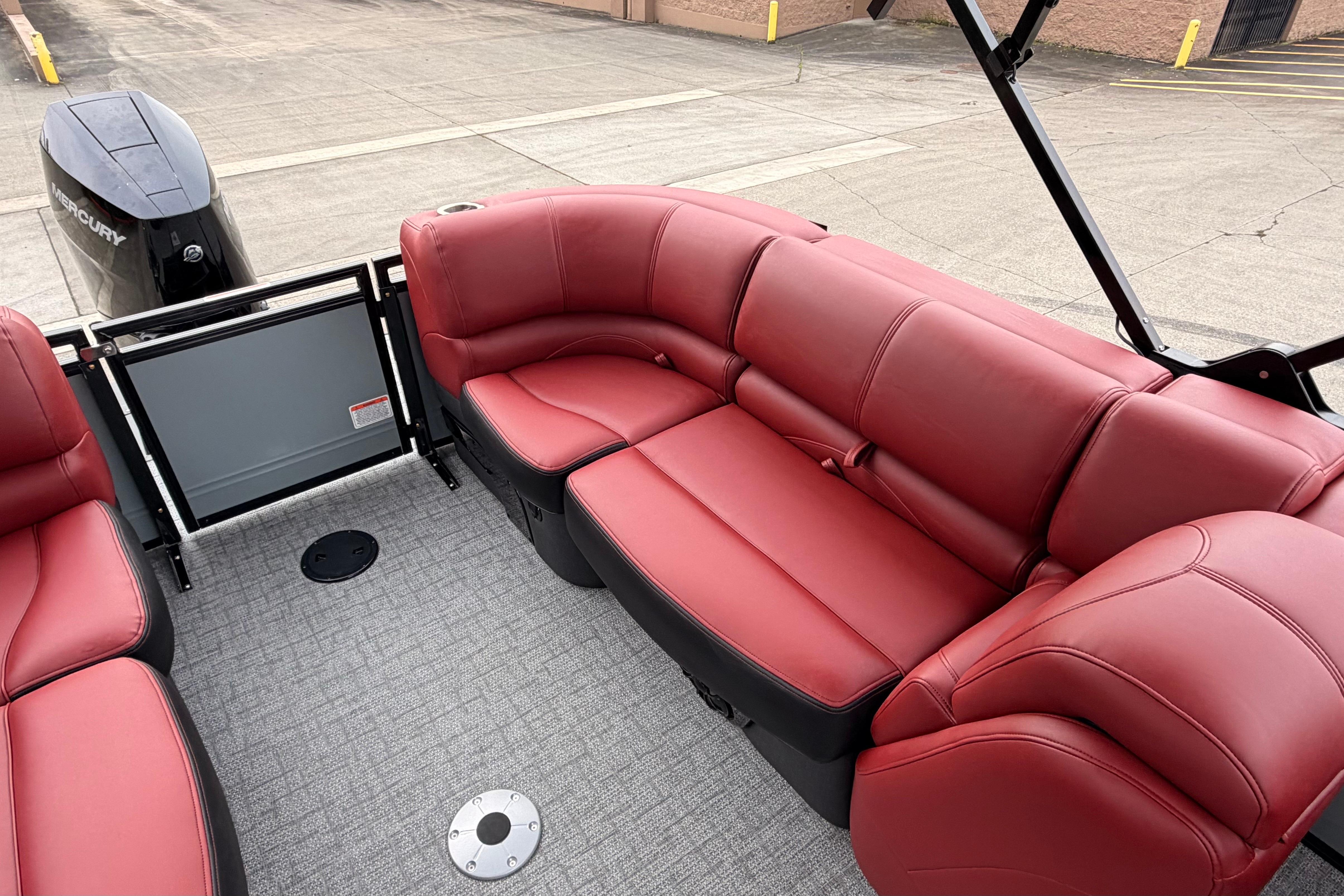 Luxurious red seating on 2026 Regency 250 DL boat, featuring spacious layout and modern design.