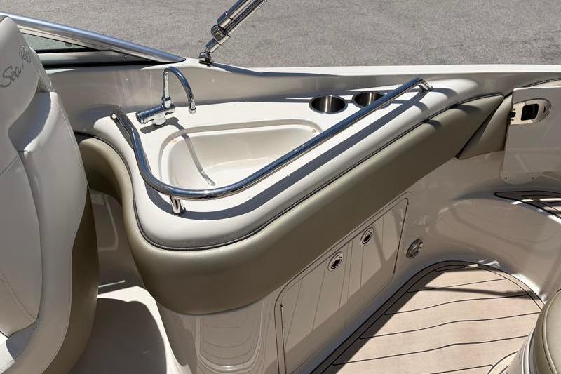 2007 Sea Ray 240 Sundeck interior with sink and cup holders.