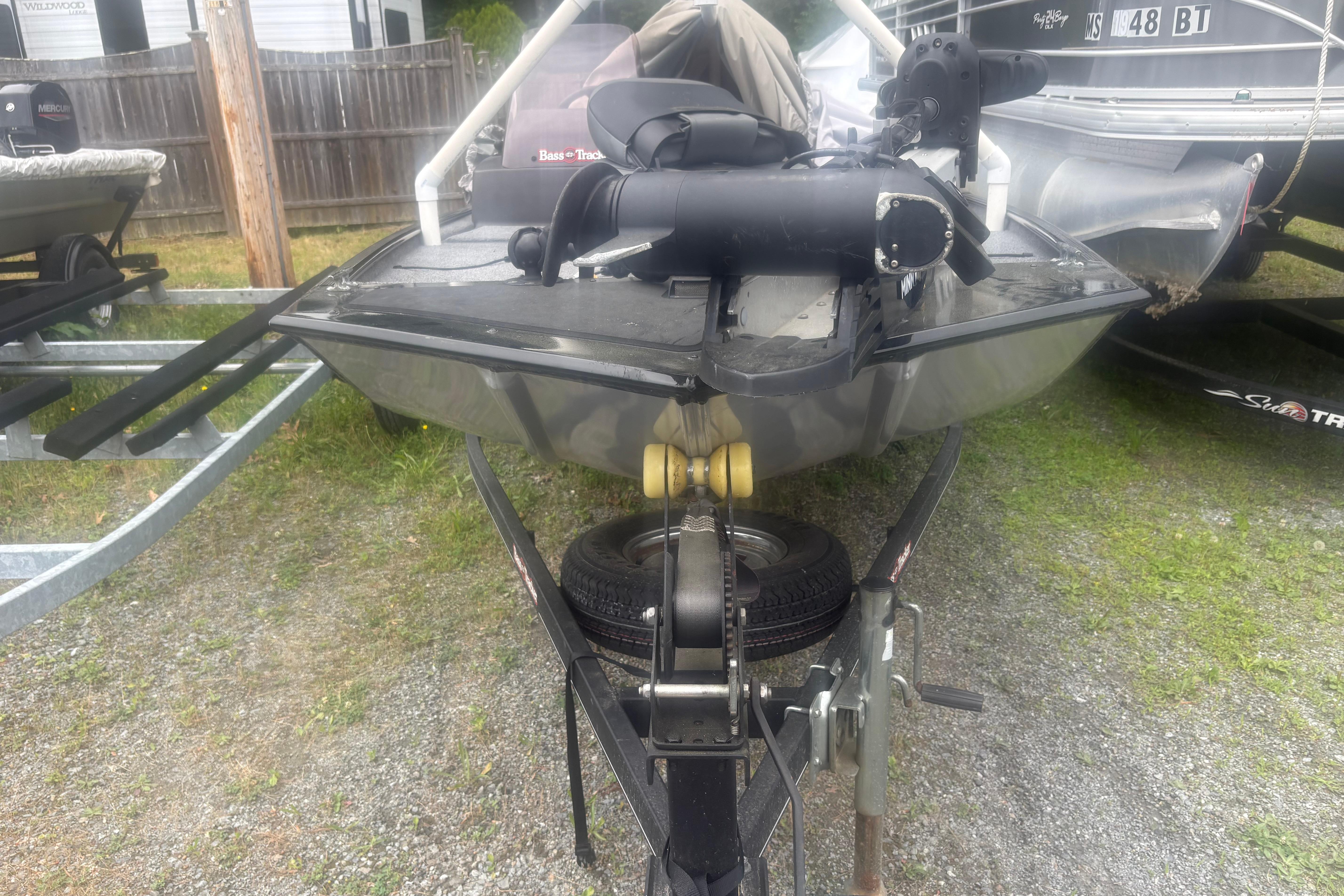 2020 Bass Tracker III Classic boat on trailer, parked outdoors.