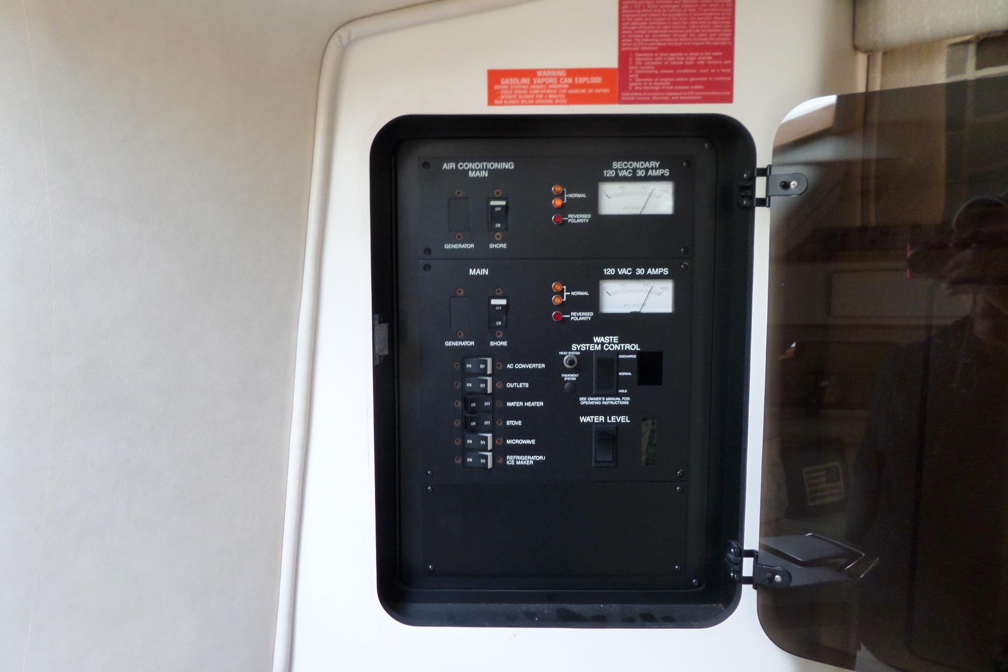 Electrical control panel on a 1994 Sea Ray 370 Express Cruiser boat.