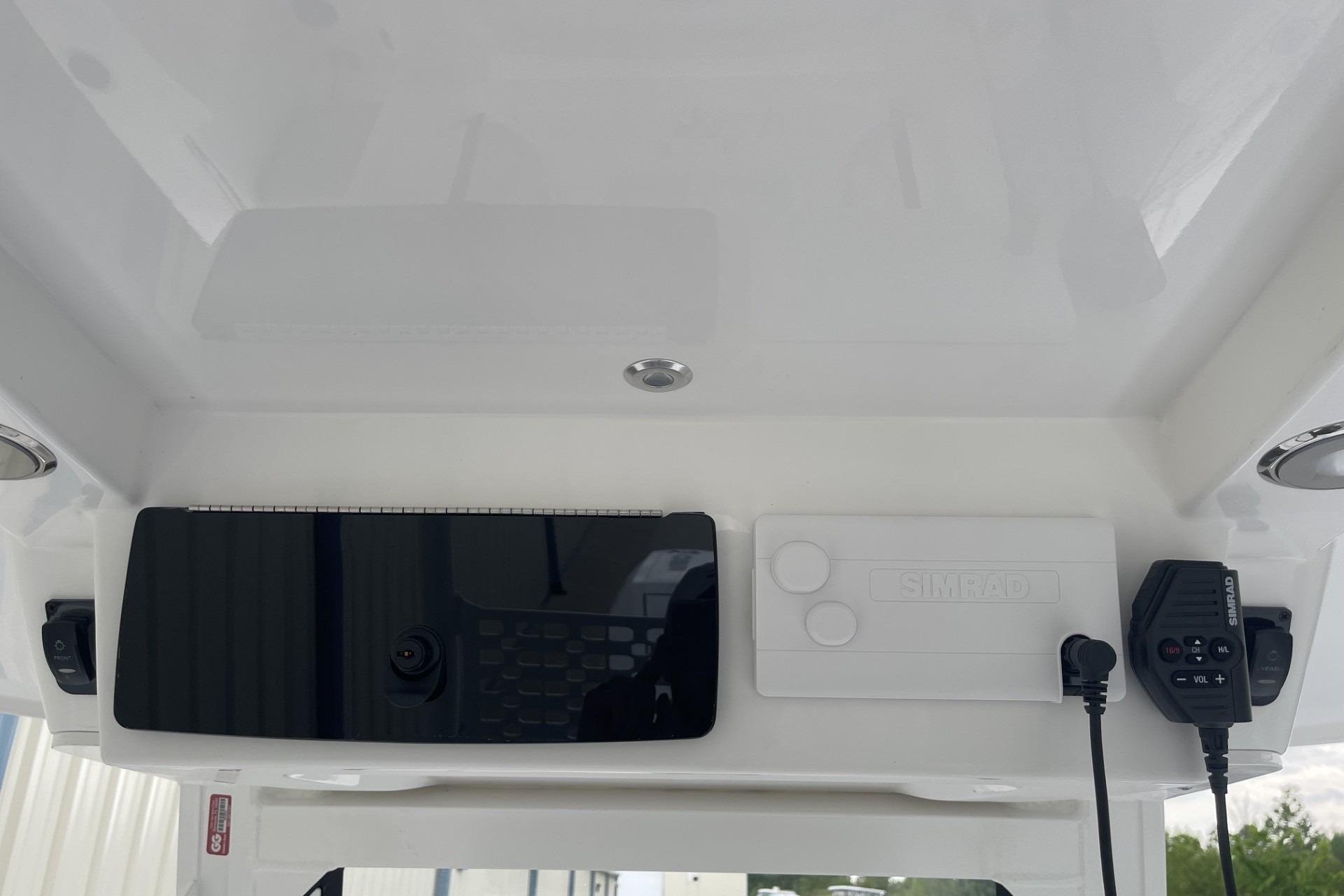 2026 Hurricane Center Console 24 OB boat dashboard with Simrad electronics and controls.