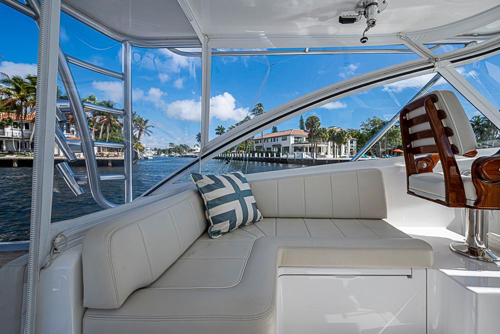 Interior of 2021 Viking 38 Open yacht with plush seating and waterfront view.