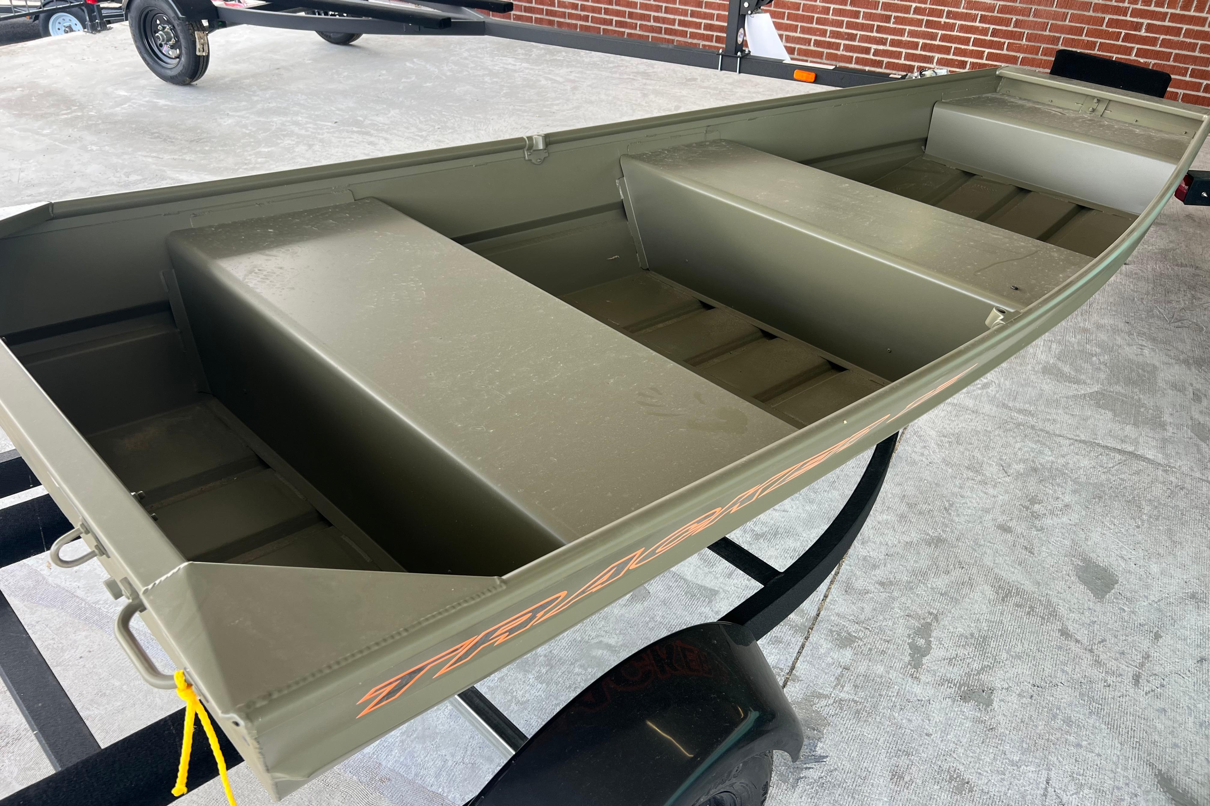 2026 Tracker Grizzly 12 Jon boat on trailer, showcasing durable aluminum construction.