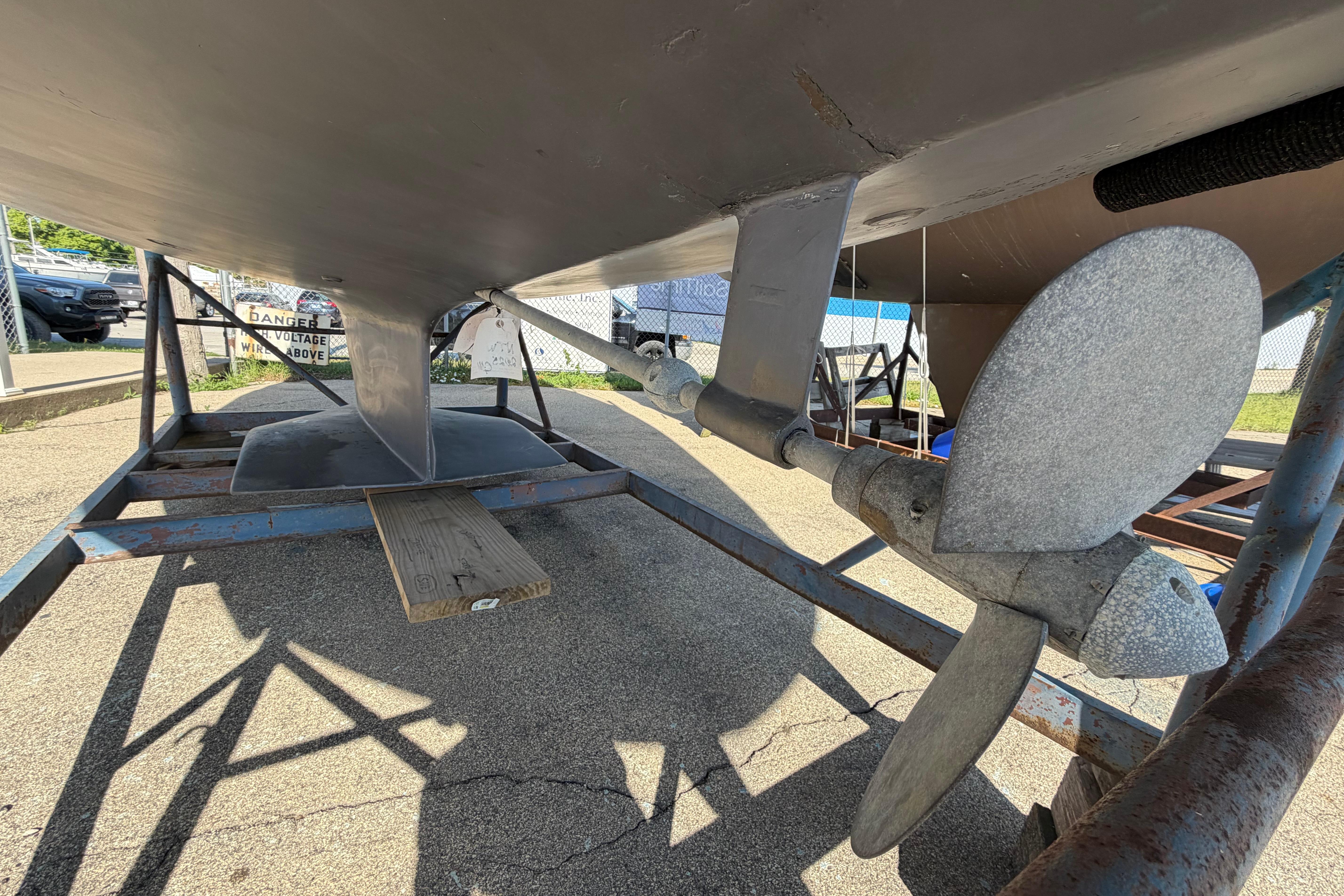 1988 Catalina 30 MkII sailboat underside with propeller and keel on a trailer.