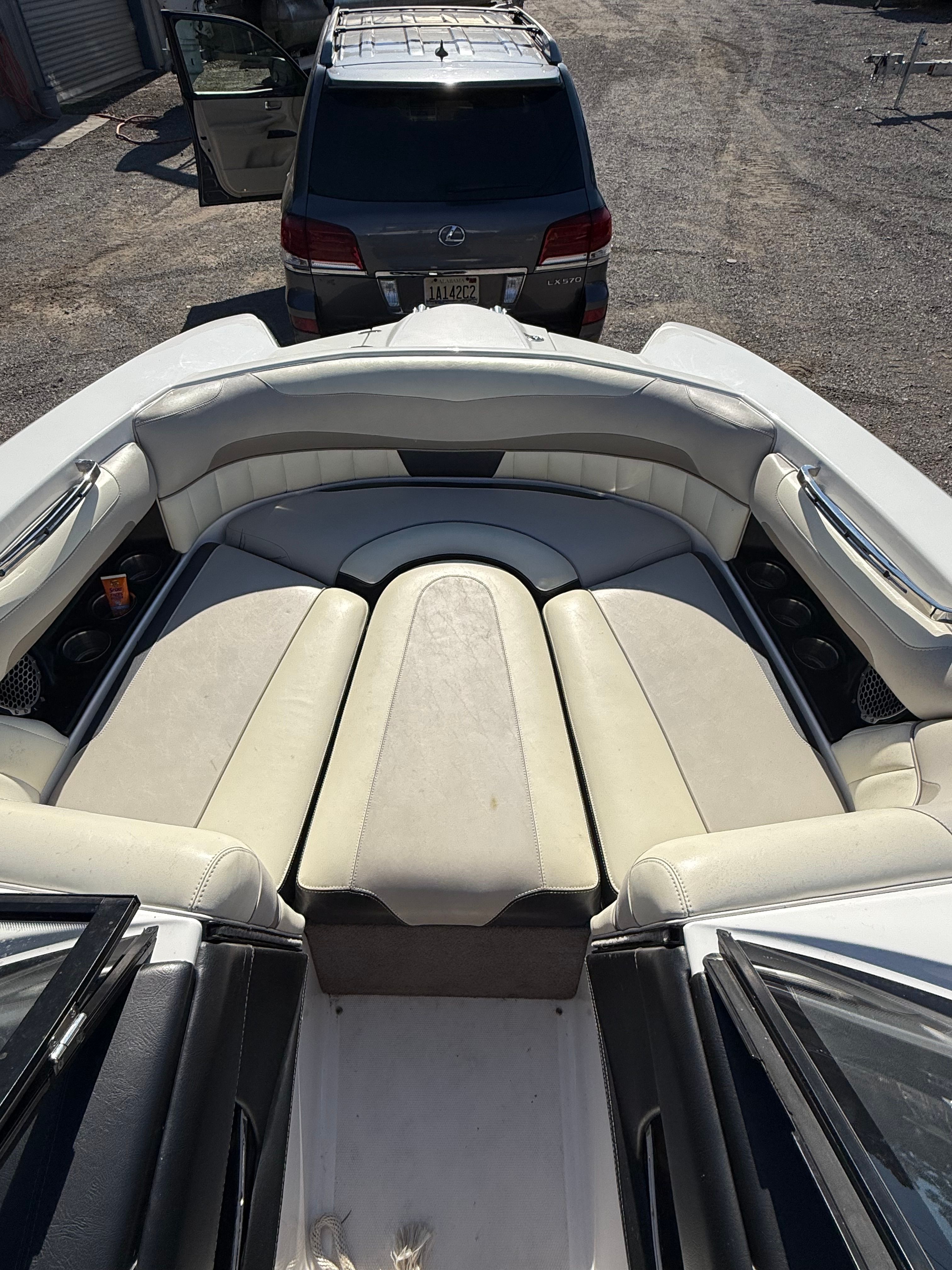 Interior view of a 2013 Malibu Wakesetter 22 MXZ with beige seating.