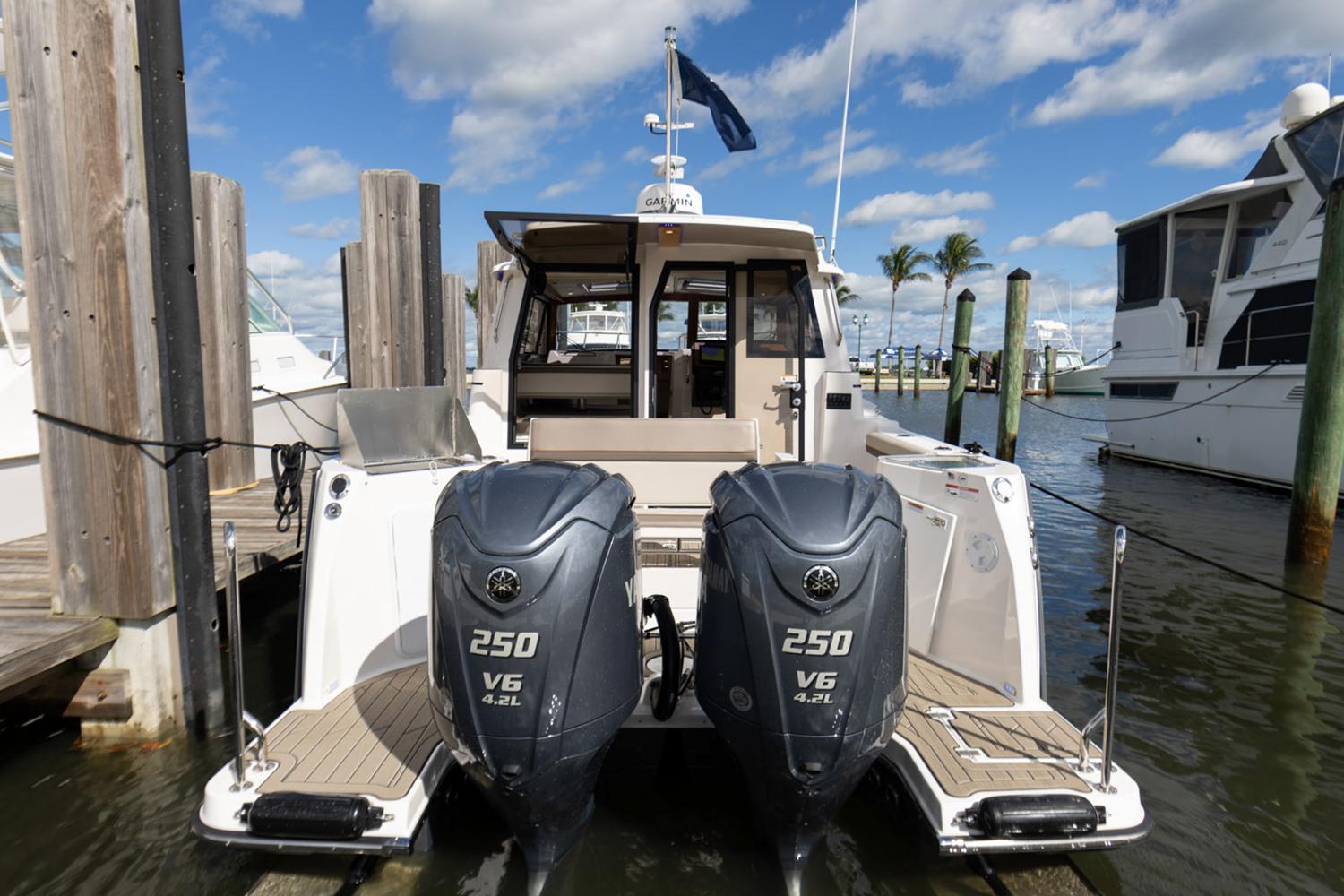 Manufacturer Provided Image: 2025 Cutwater C-288 Coupe boat docked with twin 250 V6 engines.