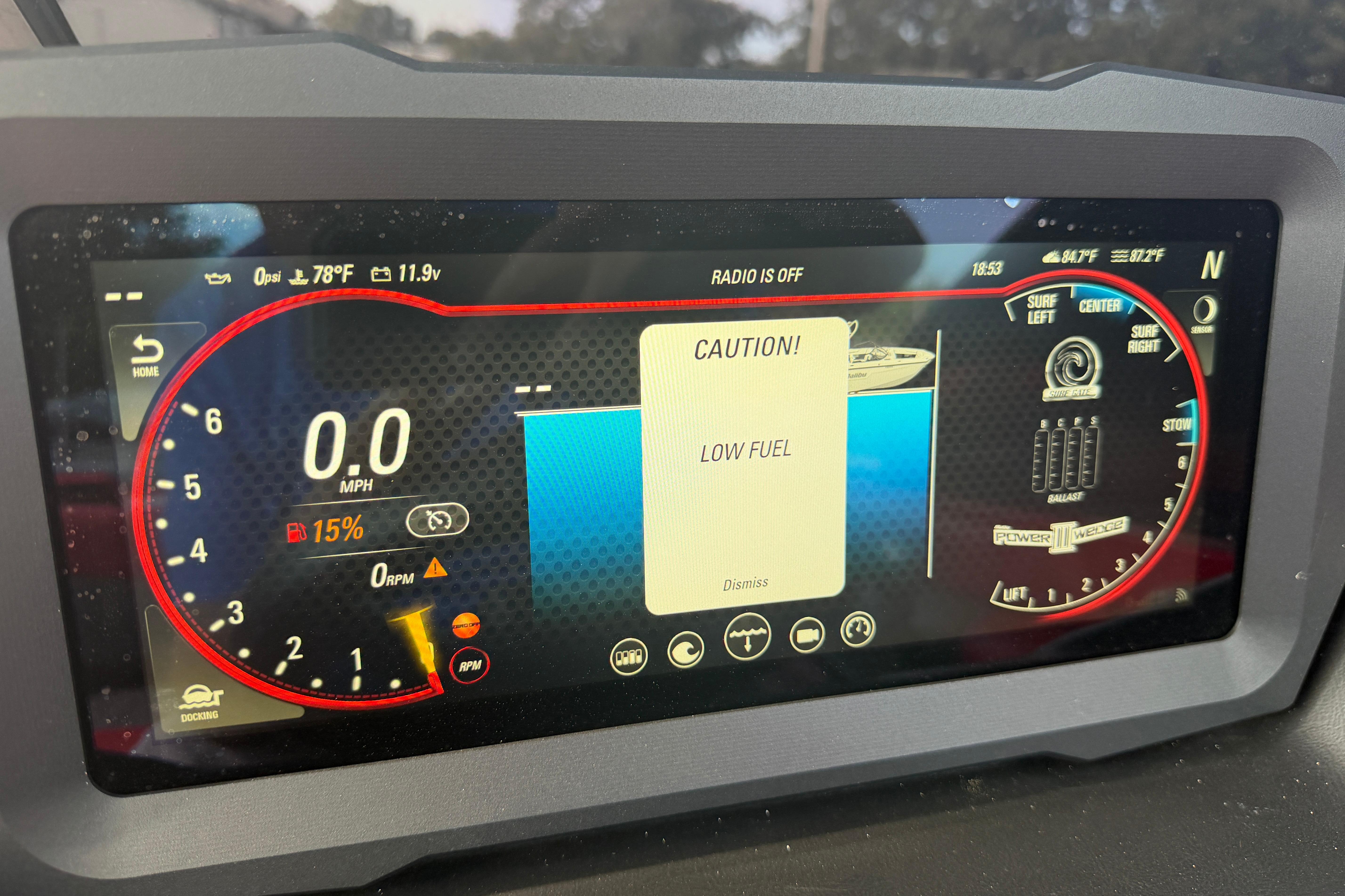 Dashboard display of a 2021 Malibu M220 showing low fuel warning.