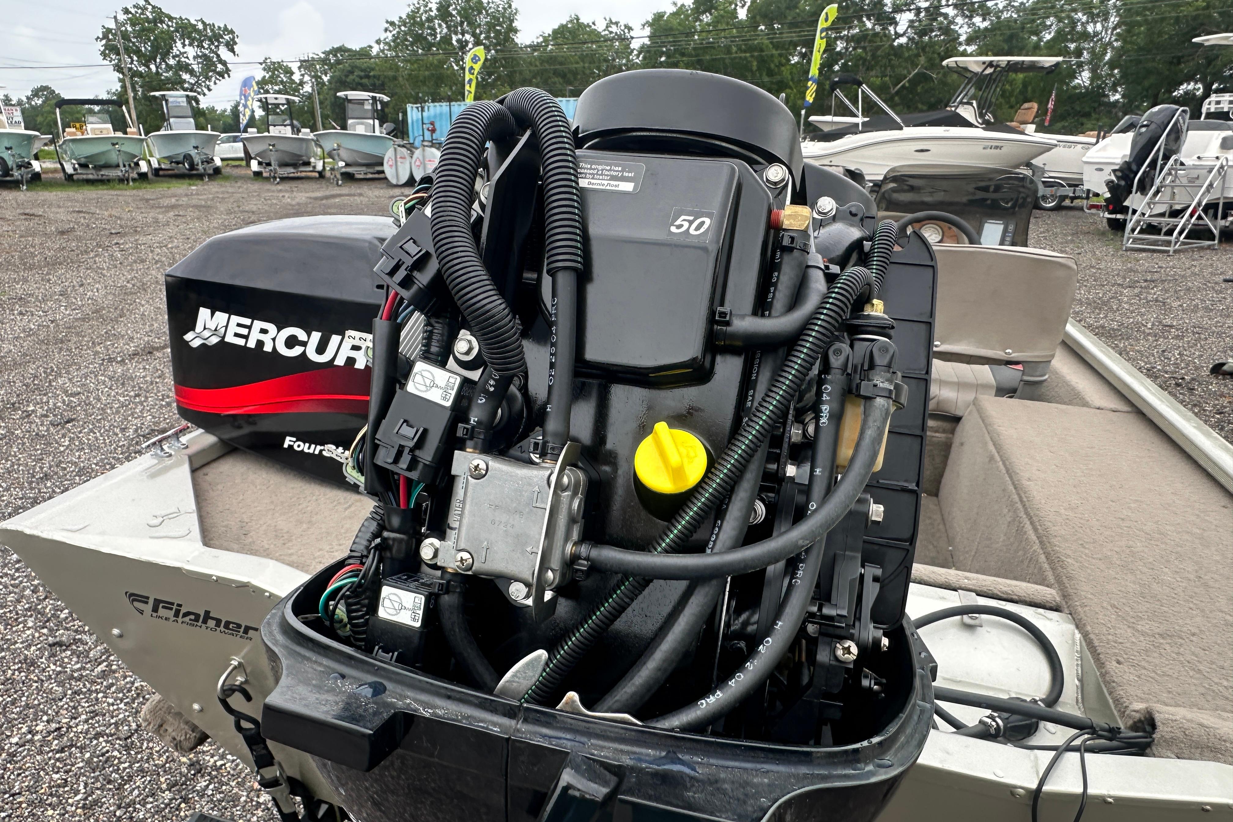 Outboard motor on a 2002 Fisher 1710 boat, featuring a Mercury engine.