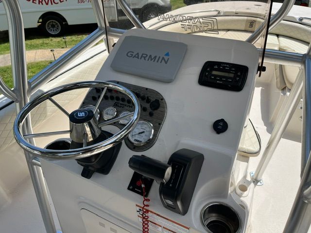 The image shows the helm of a 2022 Carolina Skiff 21 Ultra Elite with Garmin navigation.