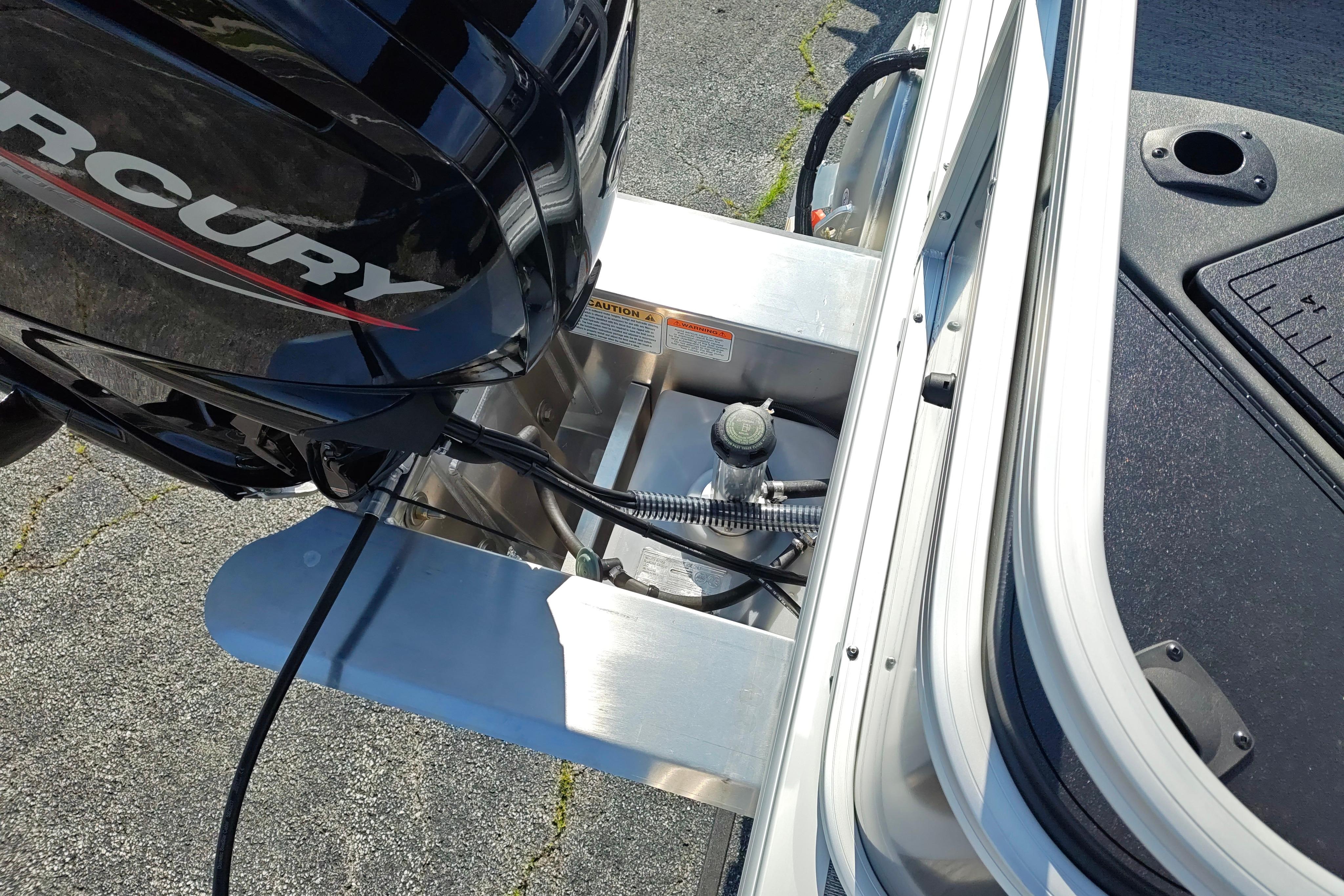 2026 Sun Tracker Bass Buggy 18 DLX with Mercury outboard motor, detailed view.