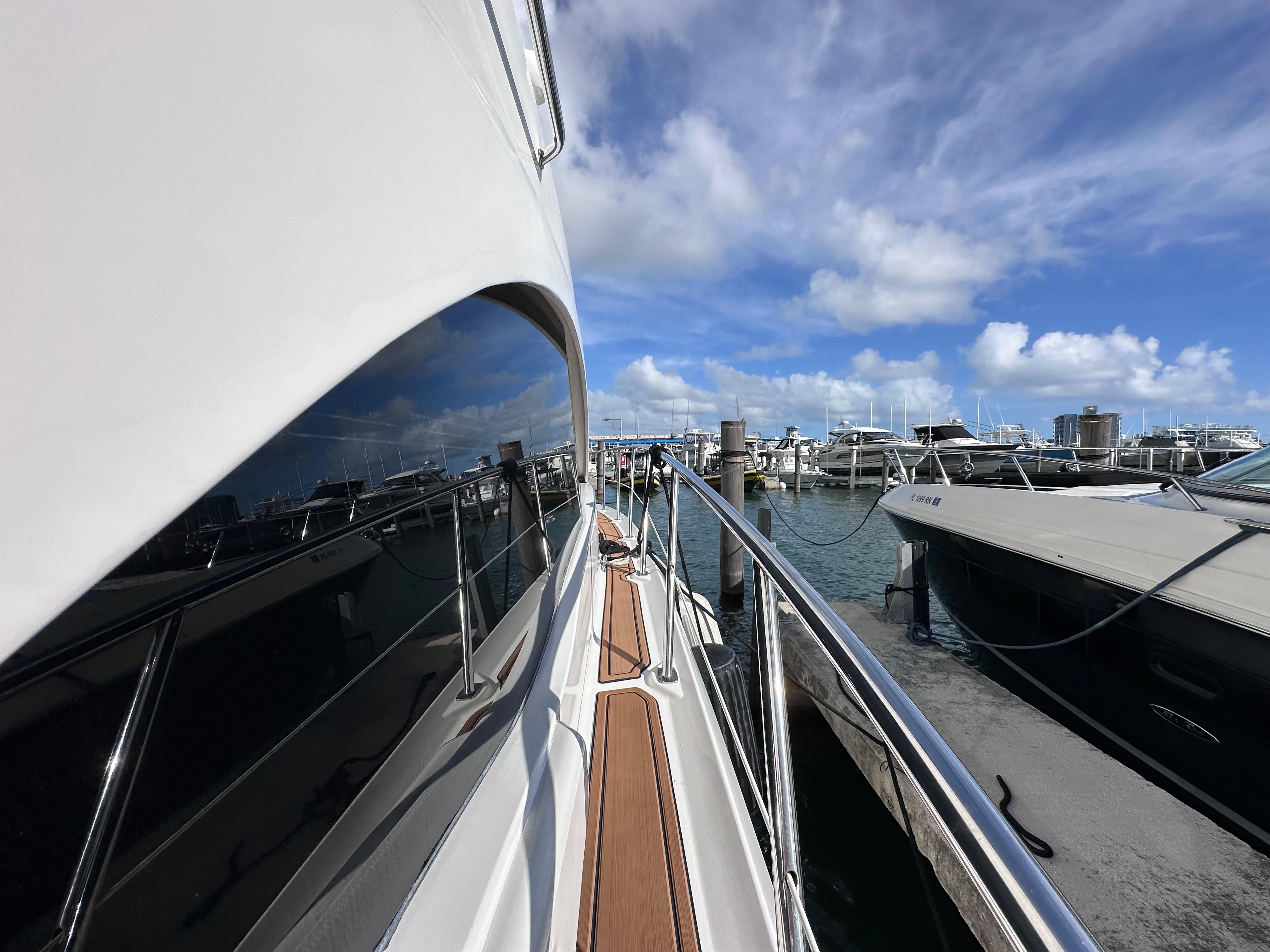 Sea Ray 36 Sedan Bridge 2007 at marina, sunny day.