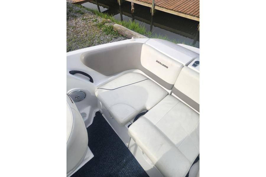 Interior seating of 2012 Sea-Doo Sport Boats 180 Challenger, featuring white upholstery.