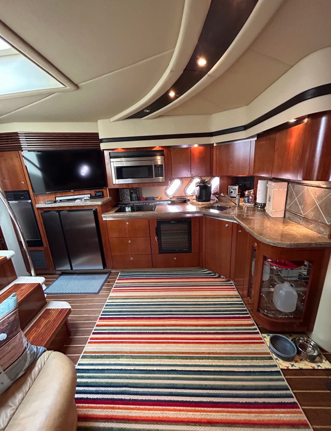 Interior of the 2009 Cruisers Yachts 520 Sports Coupe with modern kitchen and cozy ambiance.
