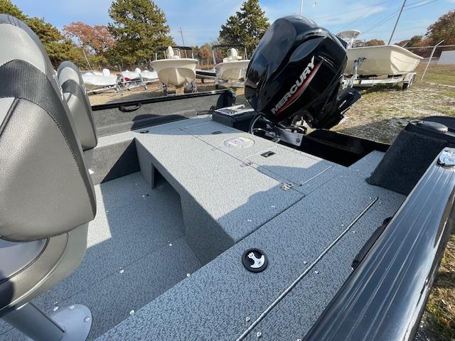 2025 Lund 1650 Rebel XL SS boat with Mercury engine, outdoor display.