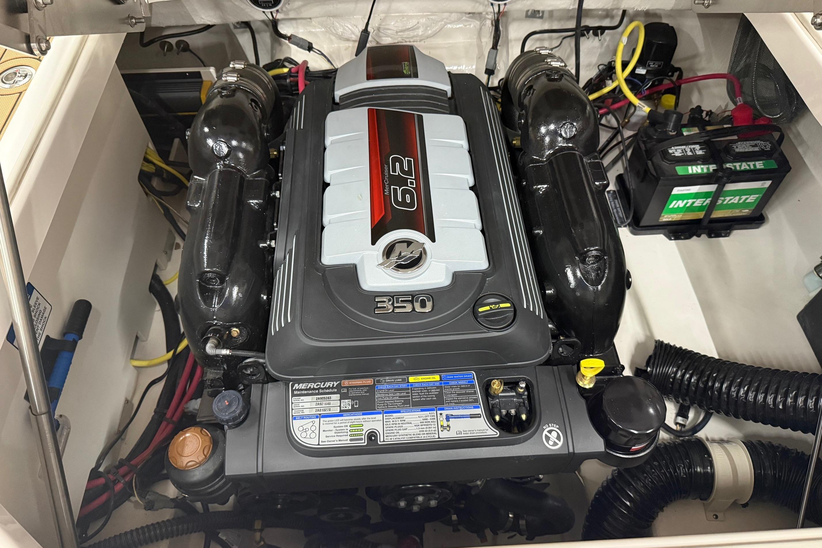 Engine compartment of 2026 Chaparral SSX 6 with Mercury 6.2L 350 horsepower engine.
