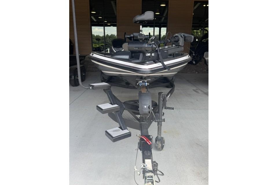 2023 Caymas CX 21 PRO boat on trailer, front view in a covered area.