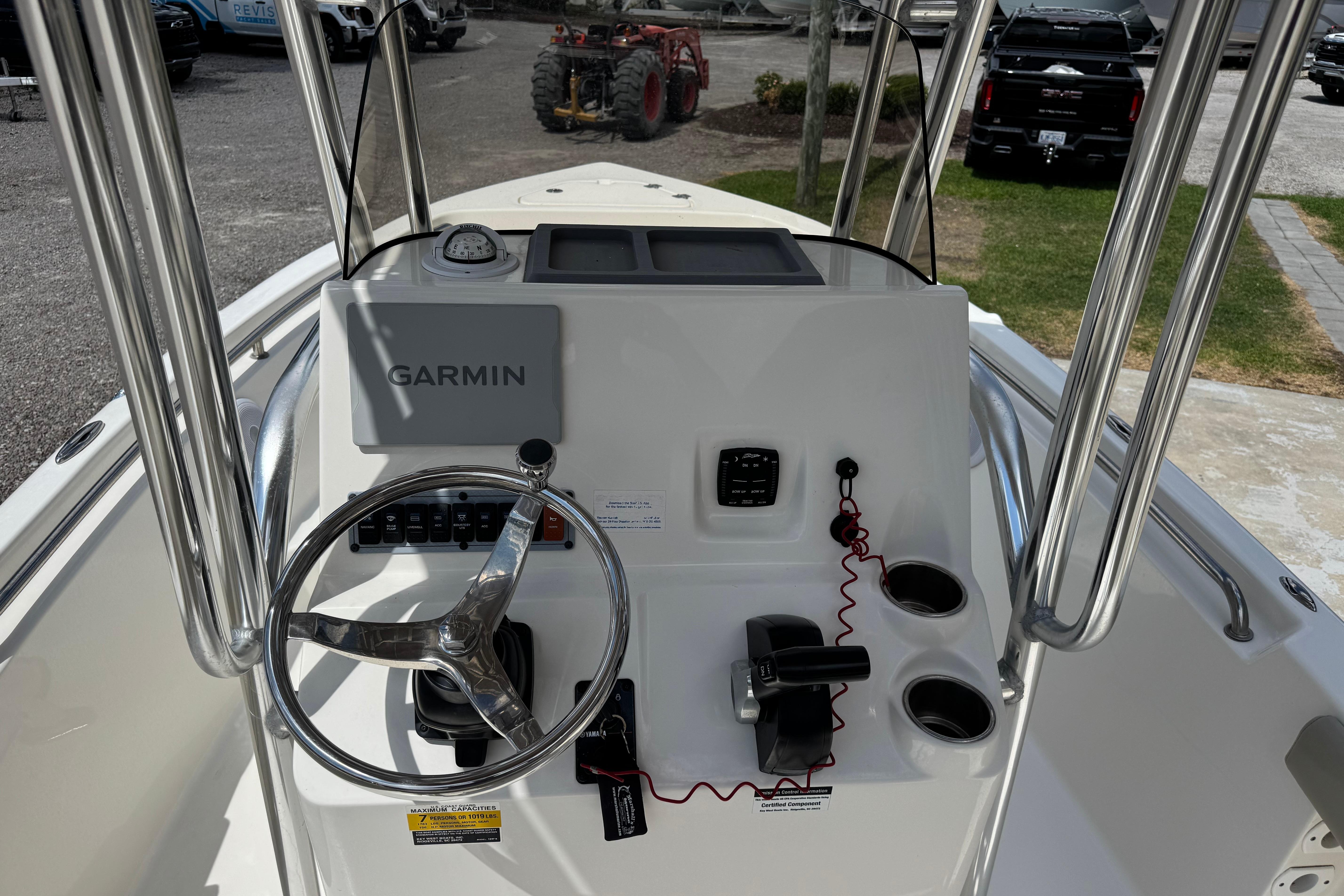 2022 Key West 189 FS boat console with Garmin navigation system and steering wheel.