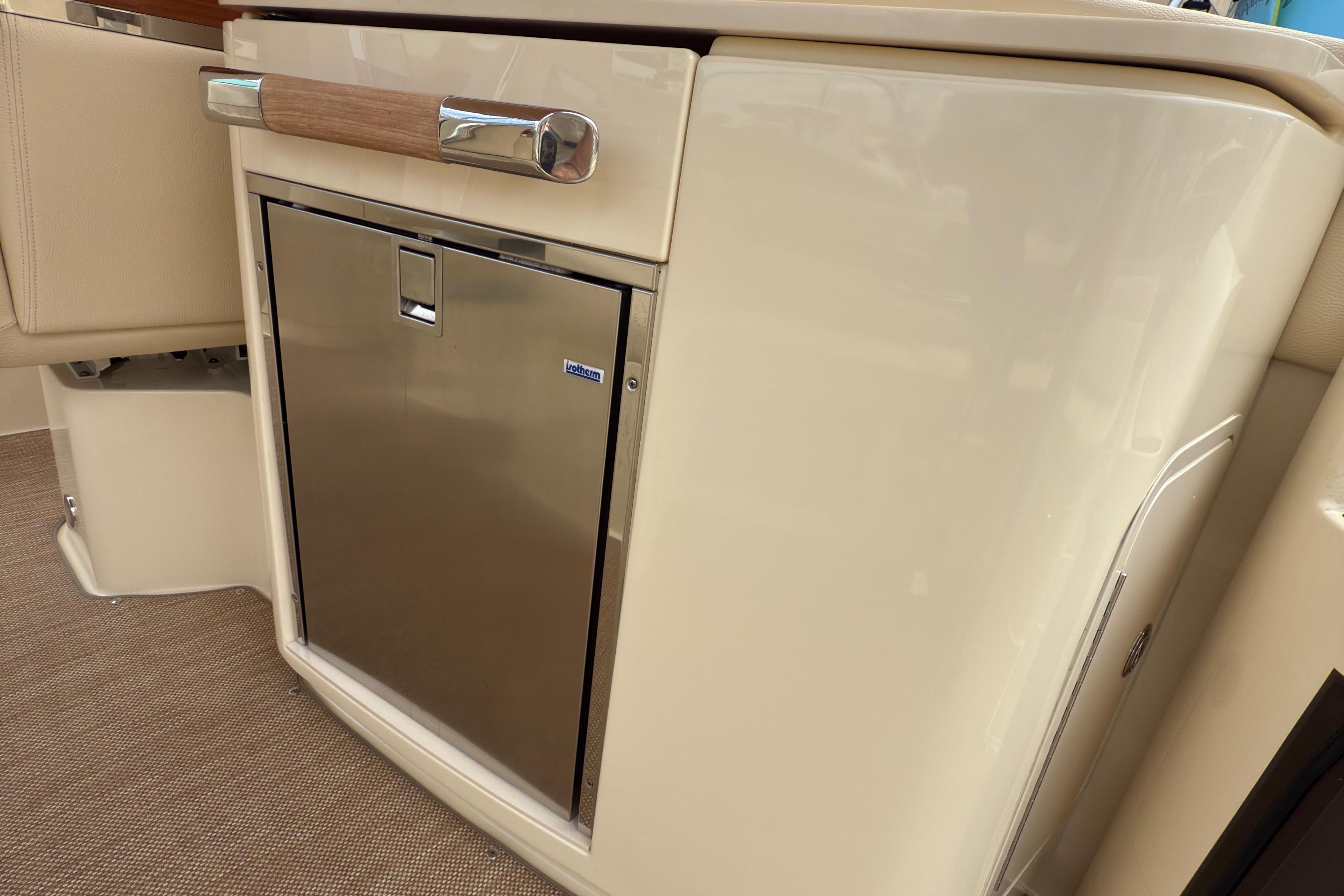 2022 Chris-Craft Launch 35 GT interior with stainless steel mini fridge.