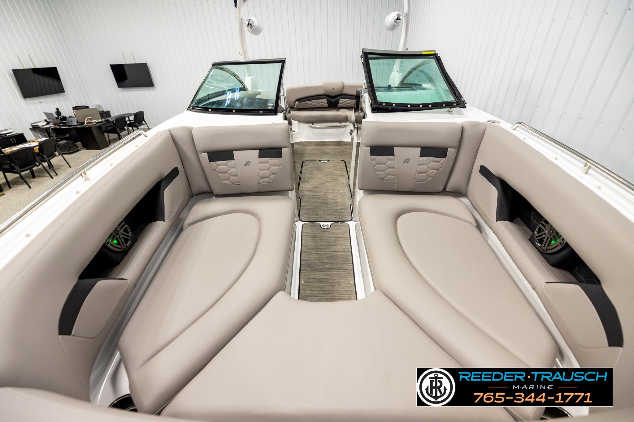 2024 FOURWINNS HD5 Surf boat interior with beige seating and modern design.