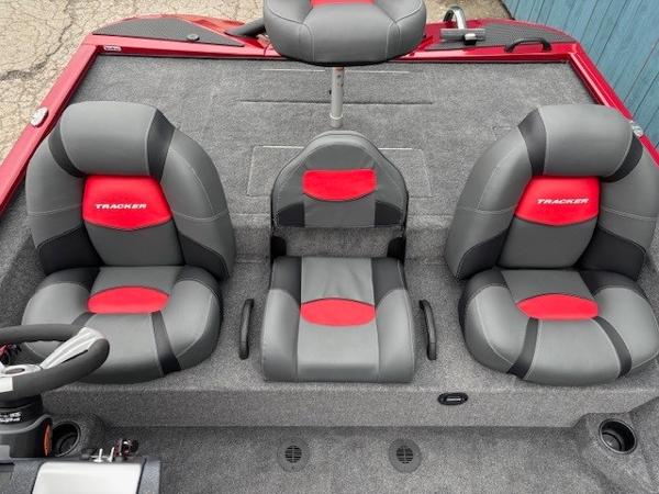 2025 Tracker Savage 215 boat seats, gray and red design, three comfortable chairs.
