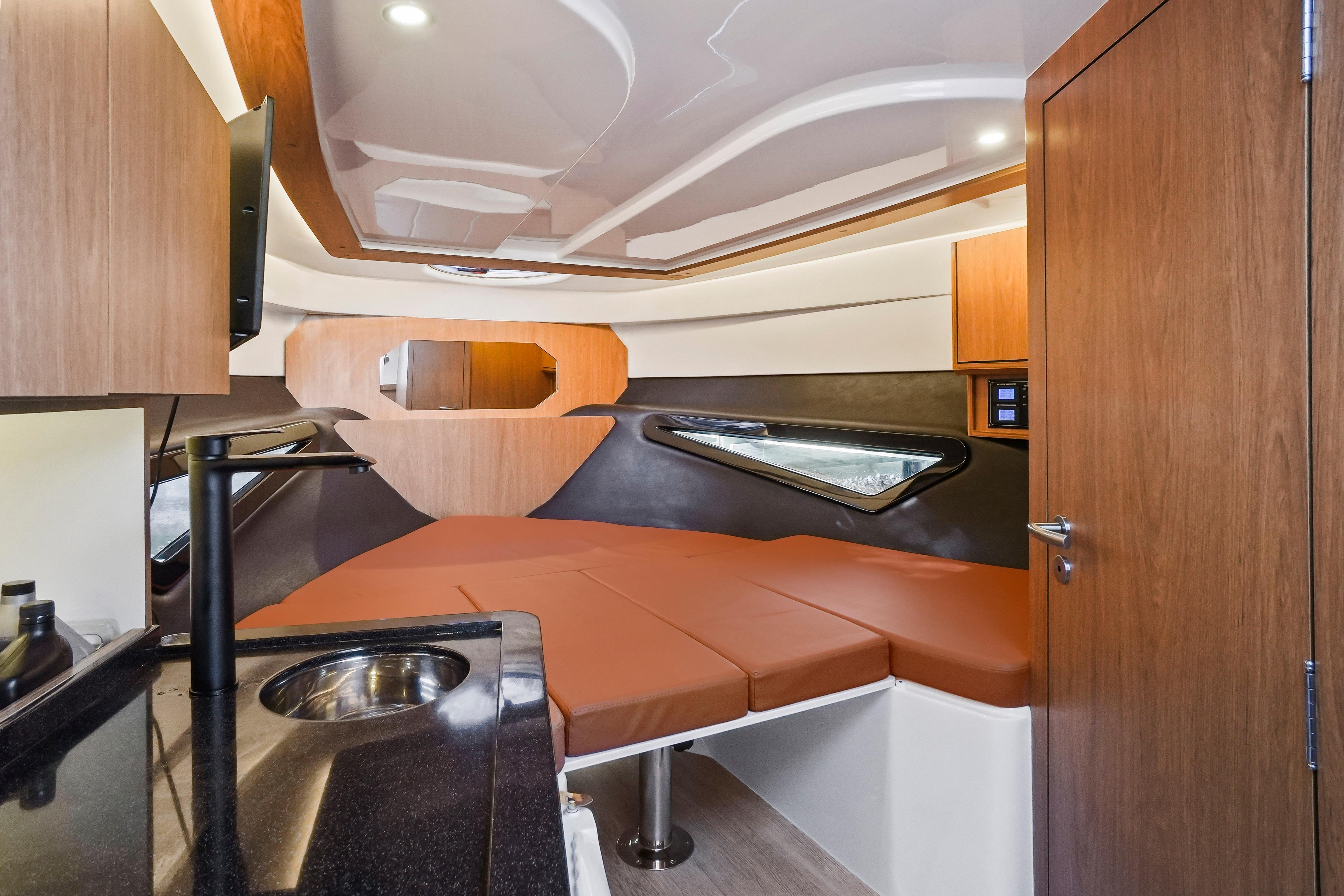 Interior of 2026 Hanover 355 boat with modern design and cozy sleeping area.