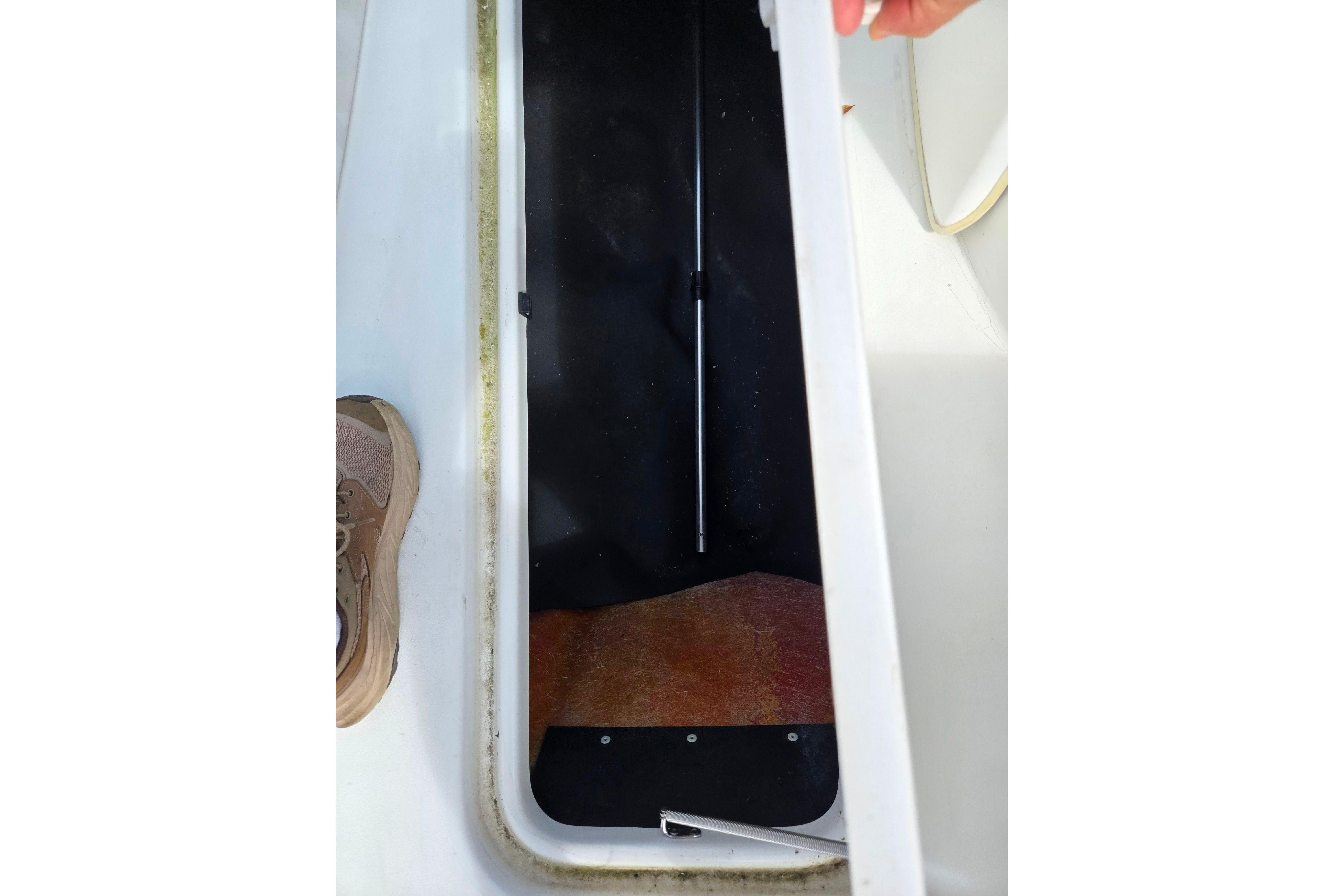 2004 Sea-Doo Islandia storage compartment with open hatch and visible interior.