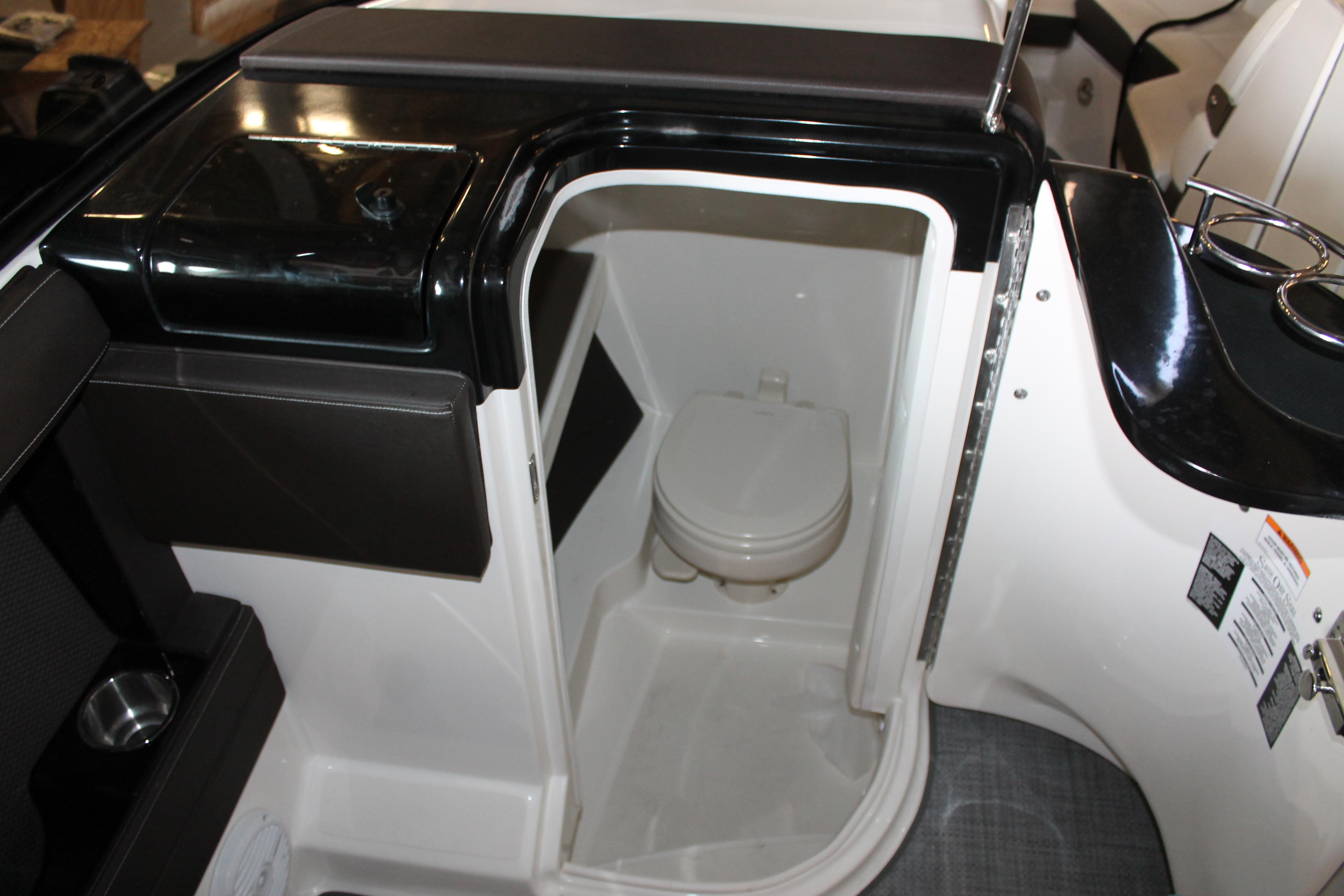 2018 Sea Ray 280 SLX boat interior with compact marine toilet.