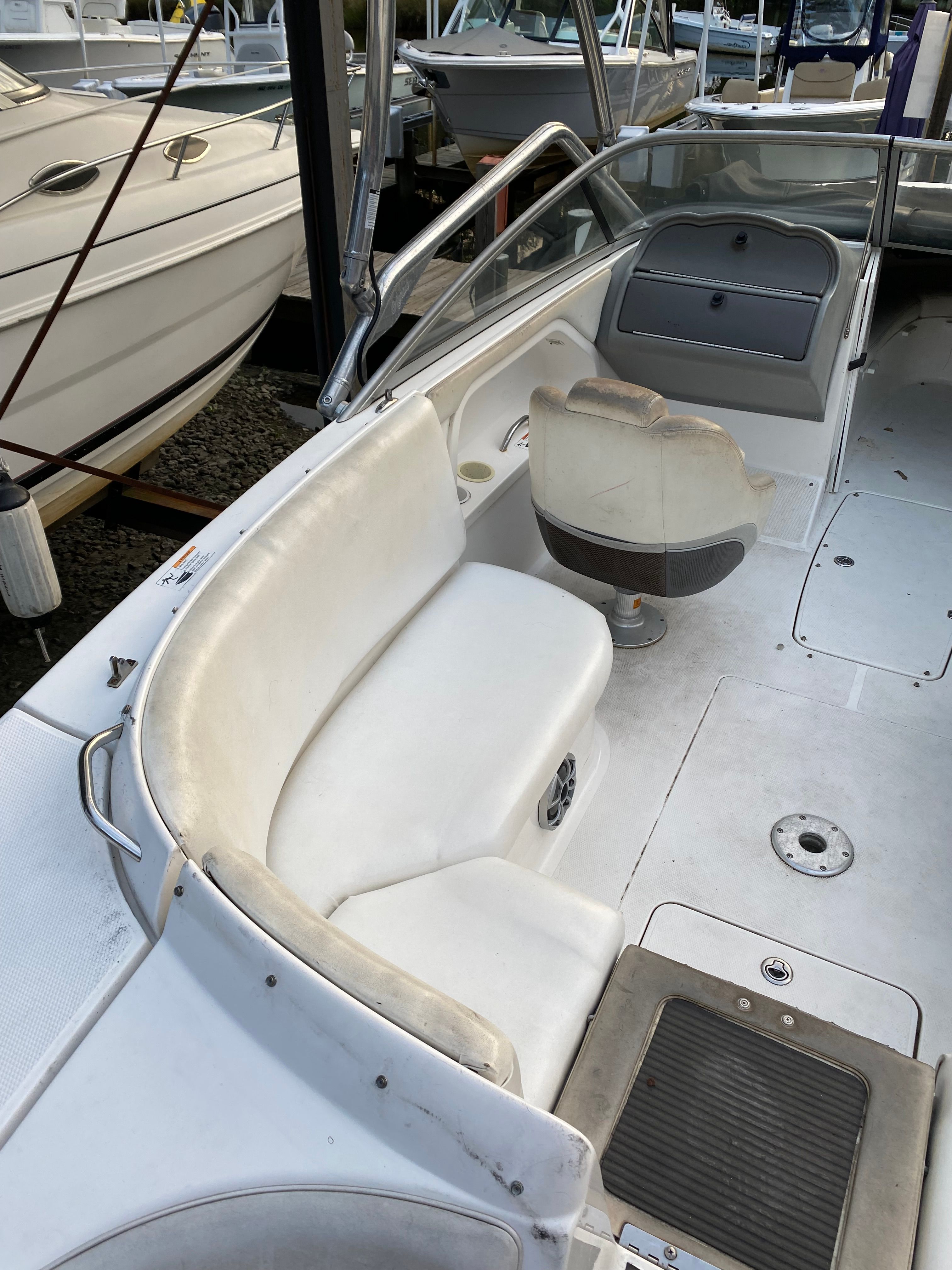 Interior of a 2005 Yamaha SX230 HO boat with white seating.