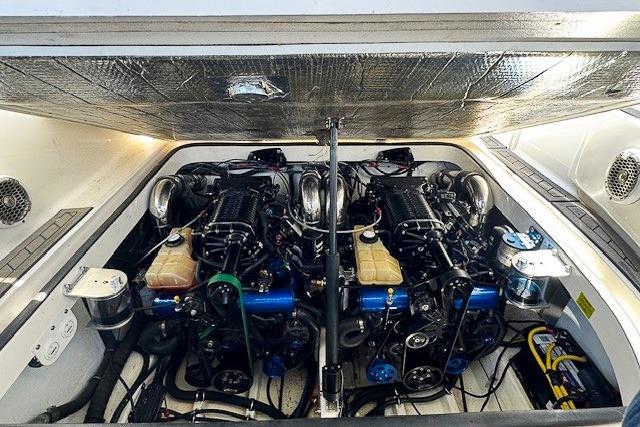 Engine compartment of a 2007 Fountain 38 Express Cruiser, showcasing dual engines and components.