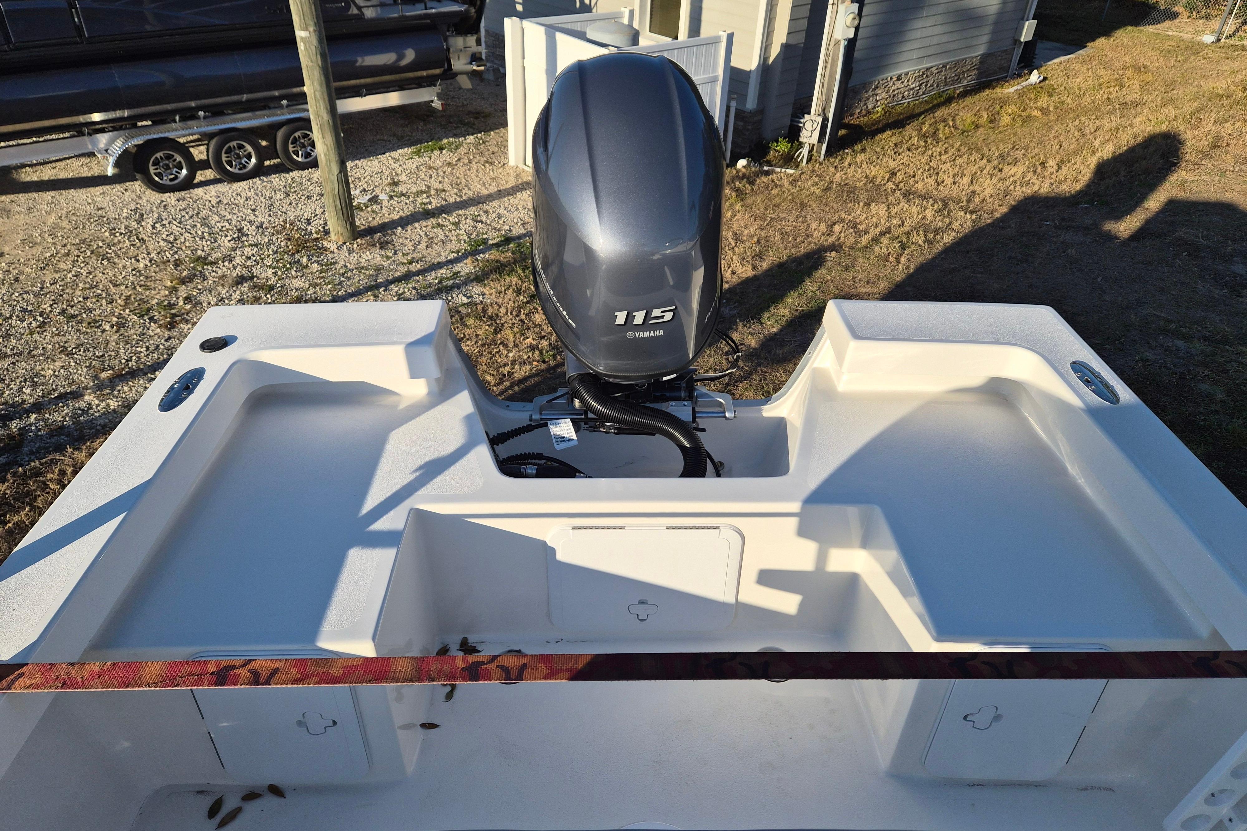 2026 May-Craft 192 boat with Yamaha 115 engine, rear view.