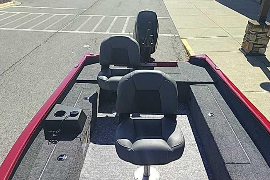 2026 Tracker Super Guide V-16 T boat interior with two black seats and red trim.
