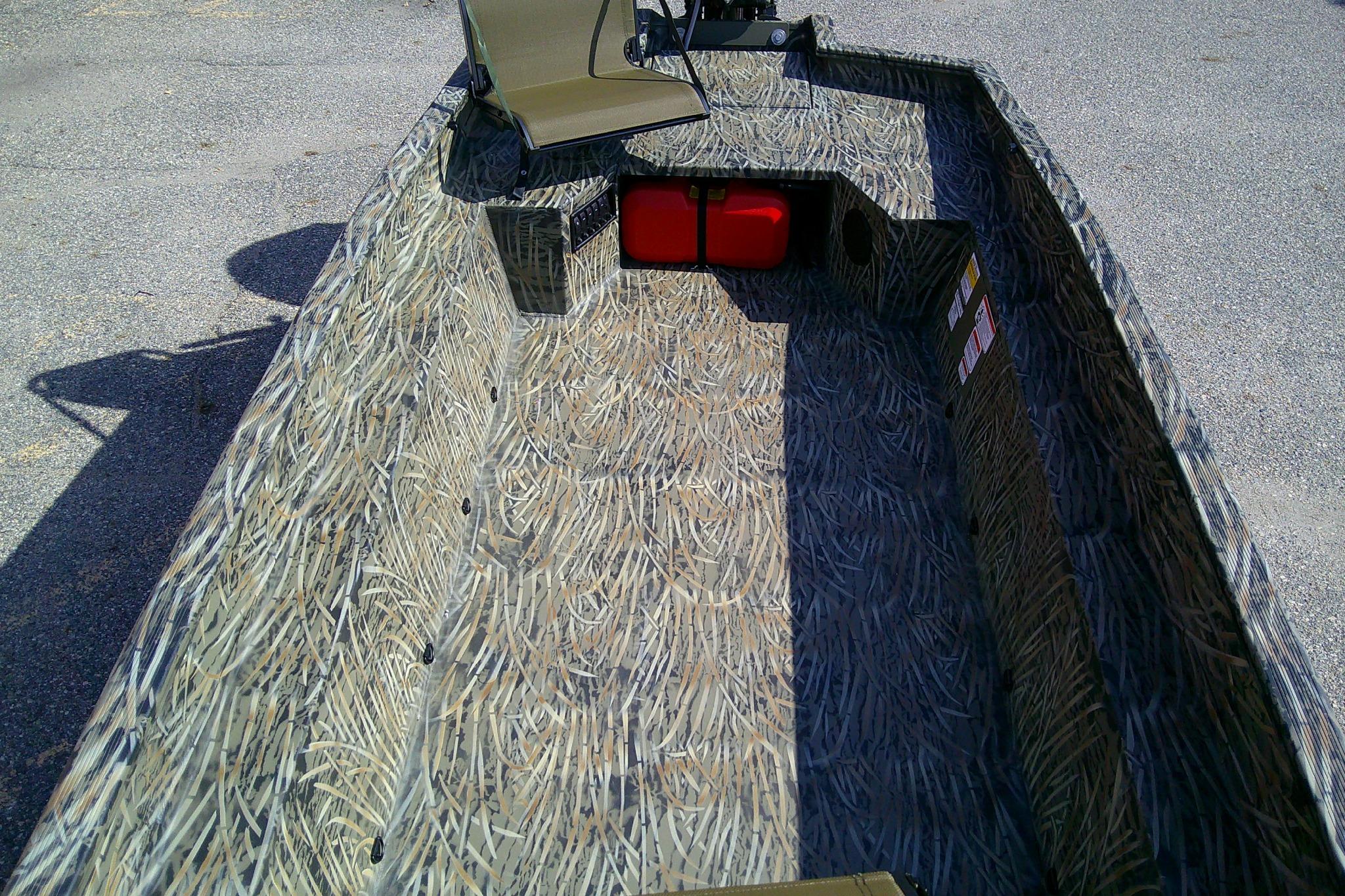 2026 Tracker Grizzly 1650 T Prairie Wings Edition boat with camouflage interior design.
