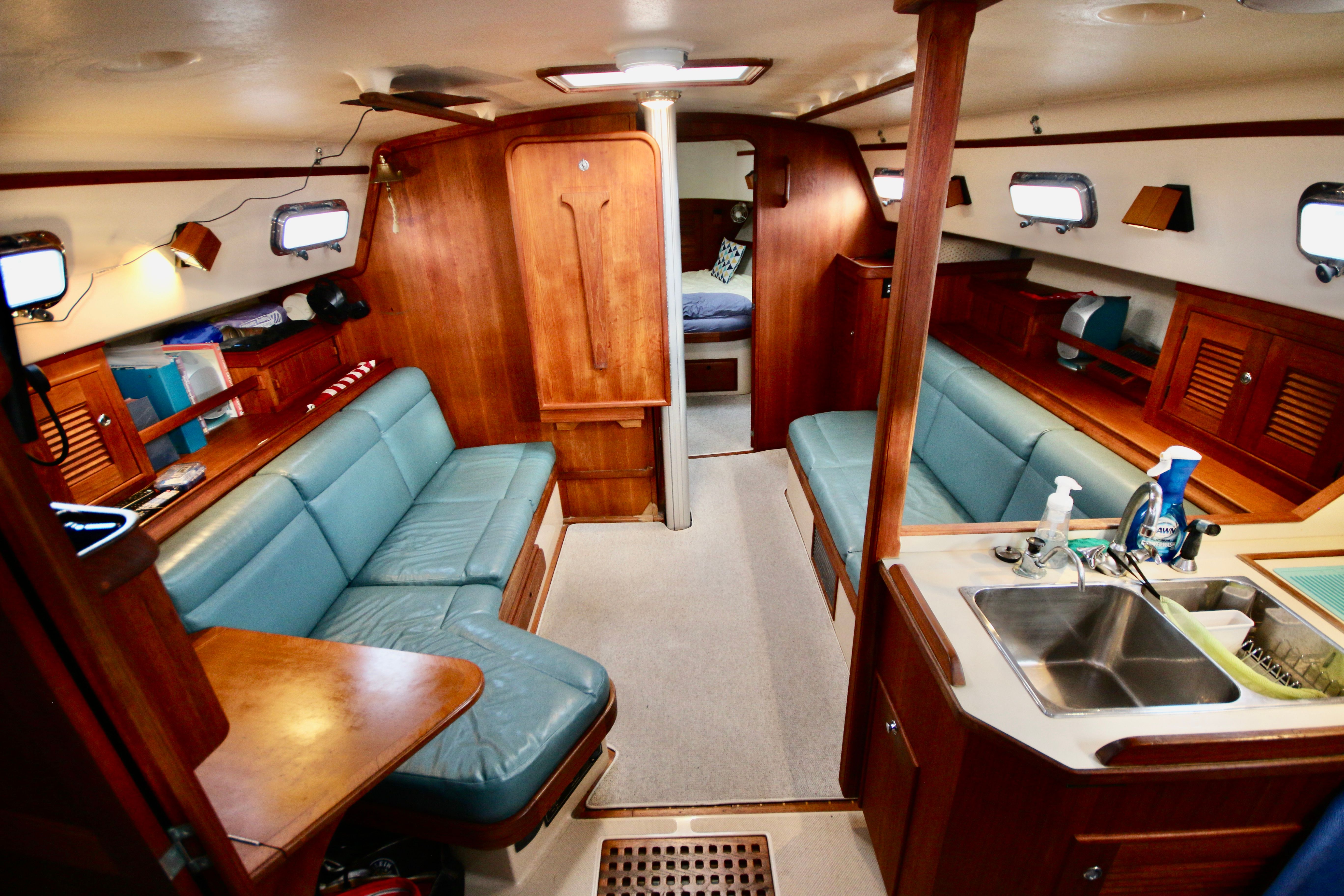 Interior of a 2002 Island Packet 380 yacht with wooden furnishings.