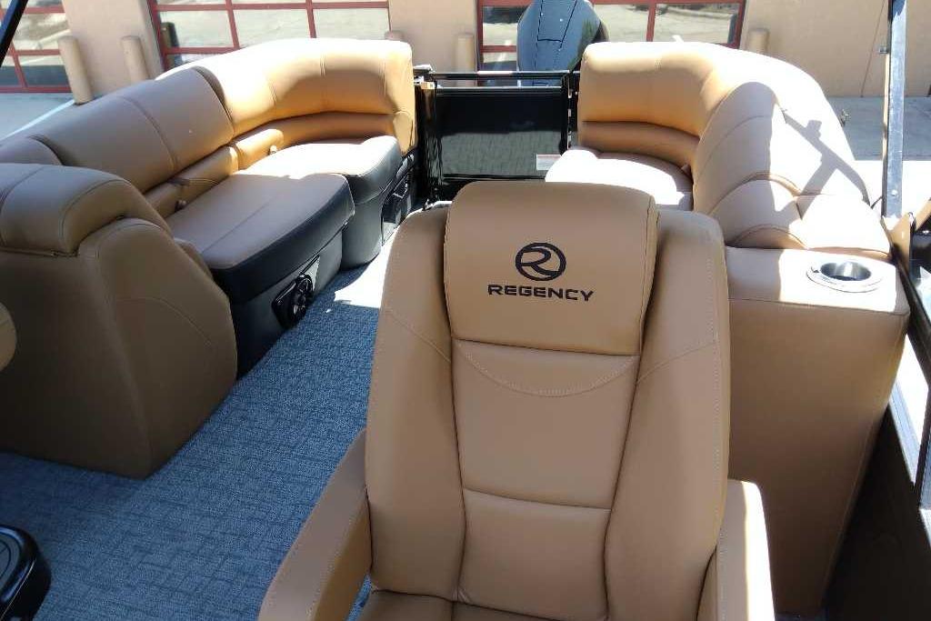 2026 Regency 230 DL boat interior with luxurious tan seating and modern design.