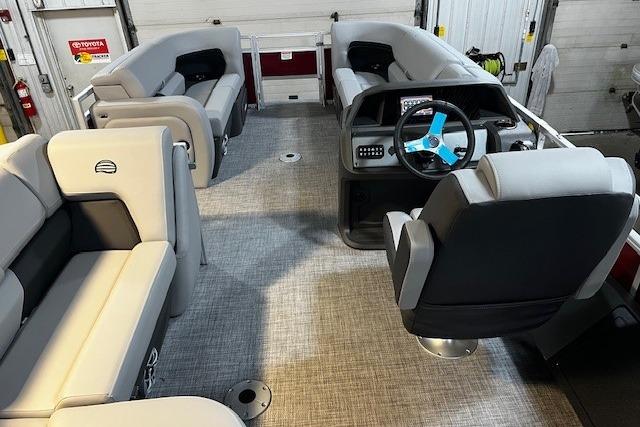 2026 Sun Tracker SportFish 22 DLX interior with modern seating and steering console.