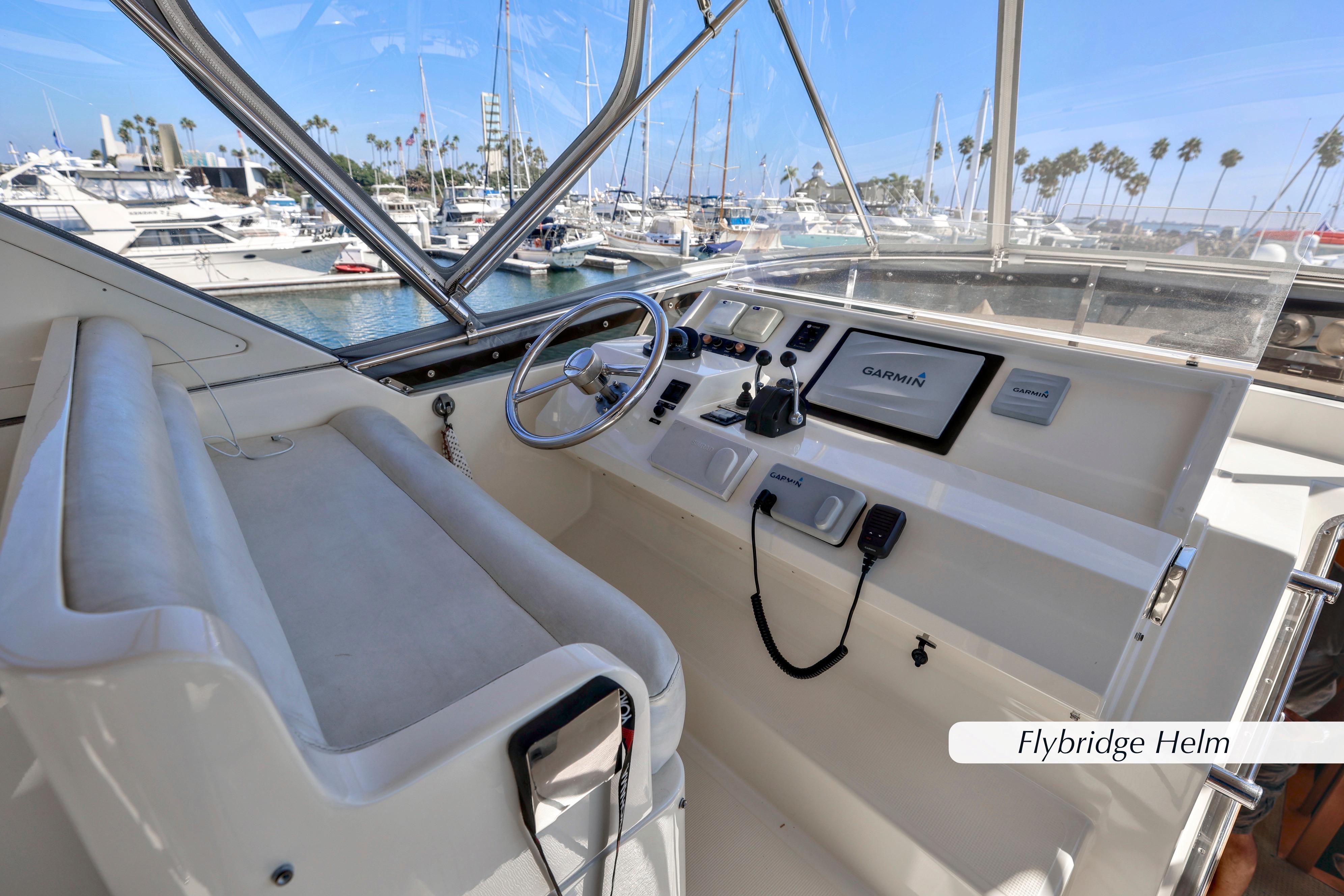 Flybridge helm of 2004 McKinna 57 Pilothouse with Garmin navigation system.